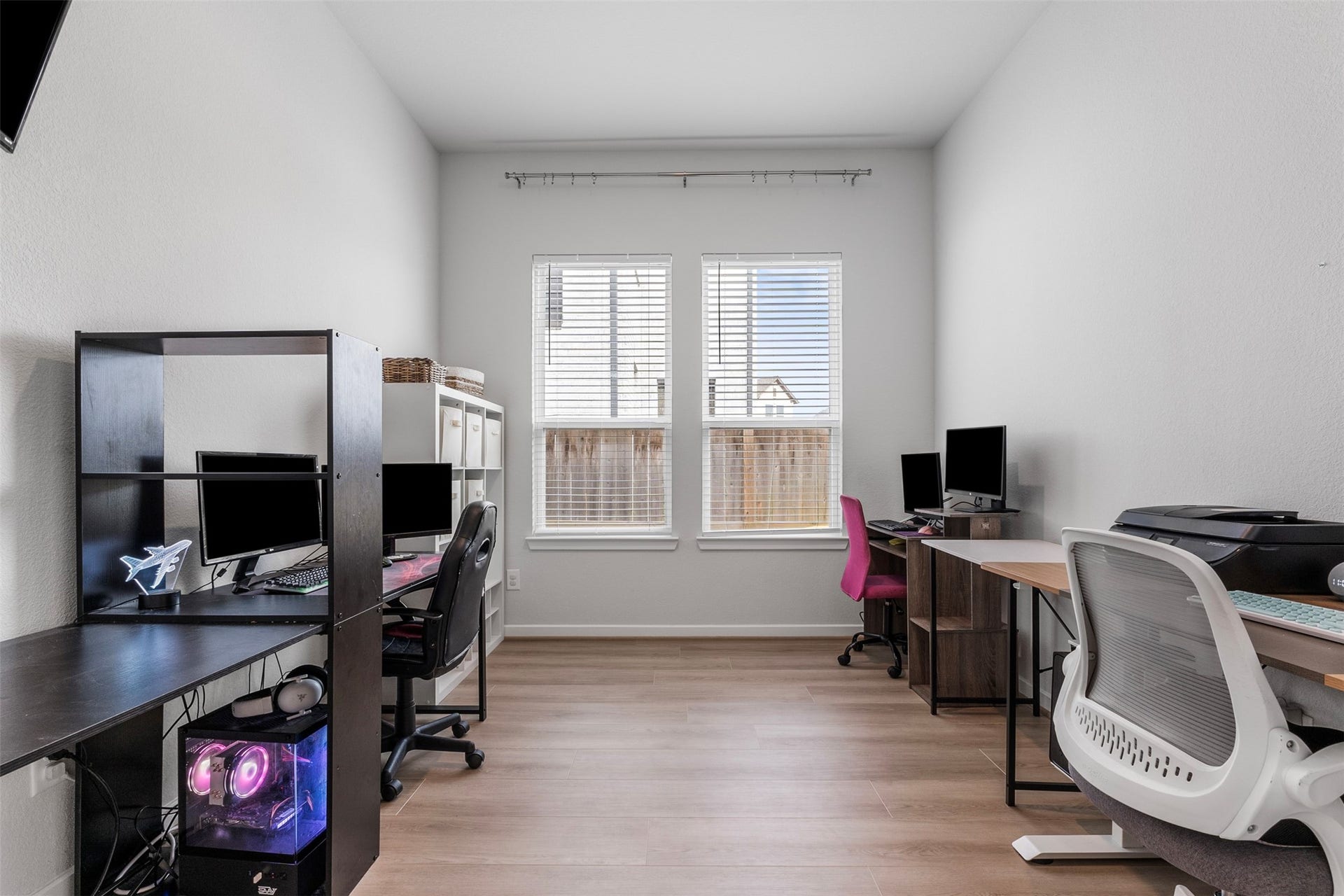 22107 Palo Dura Lane, Tomball, TX 77375 A large office with luxury vinyl flooring and natural light, roomy enough for several workstations, also has French doors.