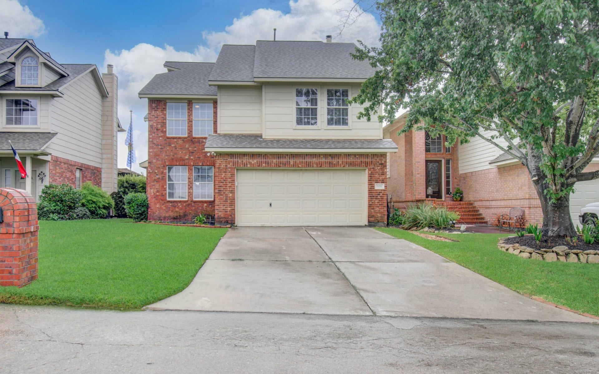 108 April Cove, Conroe, TX 77356 Discover your dream home at 108 April Cove, featuring a charming two-story design with a welcoming brick faade, nestled in a serene neighborhood.