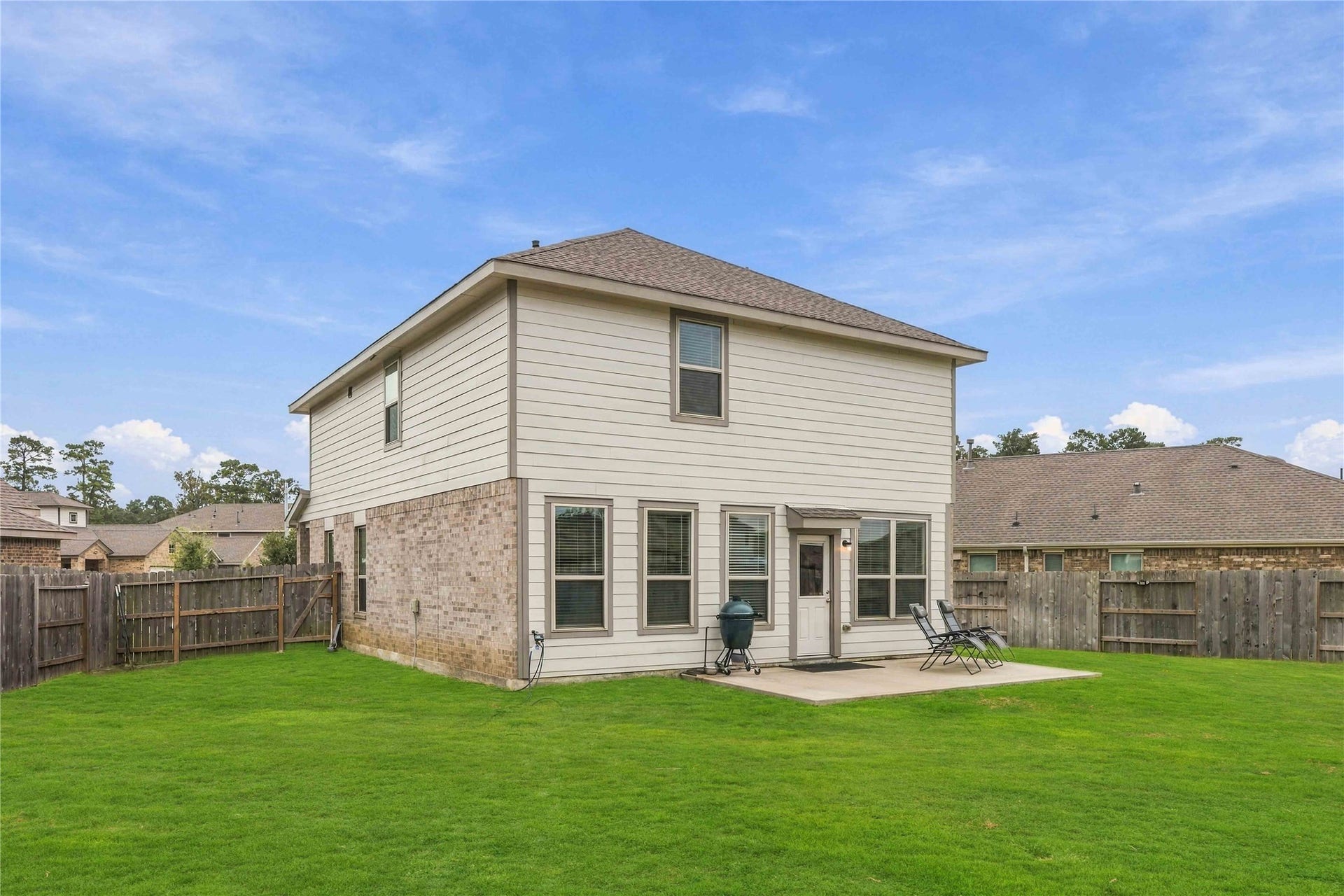 19302 Via Vinovo Court, New Caney, TX 77357 *Grass digitally enhanced to illustrate potential lawn appearance with improved turf conditons