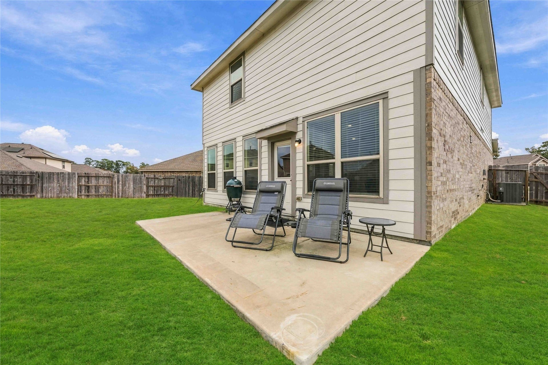 19302 Via Vinovo Court, New Caney, TX 77357 *Grass digitally enhanced to illustrate potential lawn appearance with improved turf conditons