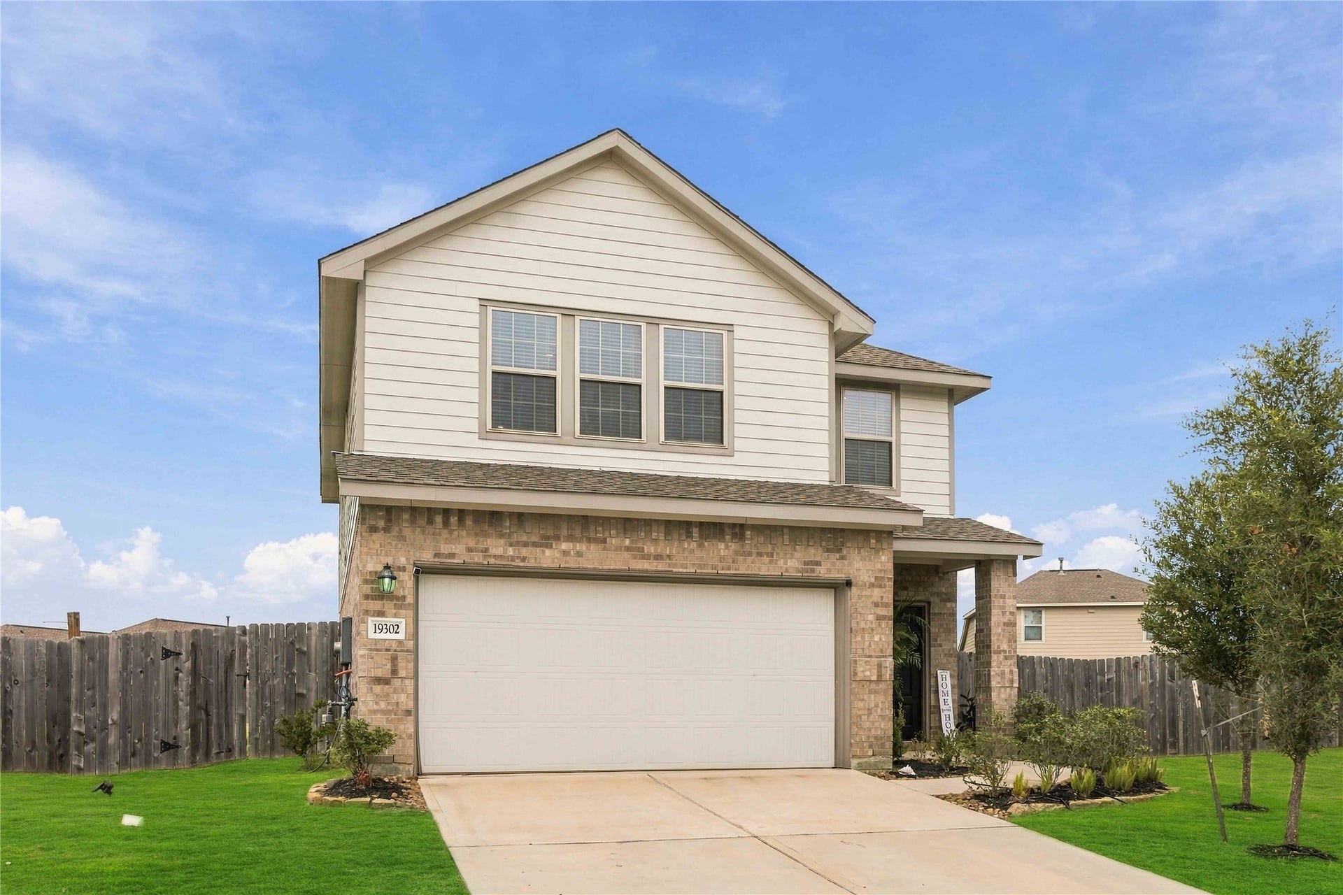 19302 Via Vinovo Court, New Caney, TX 77357 *Grass digitally enhanced to illustrate potential lawn appearance with improved turf conditons