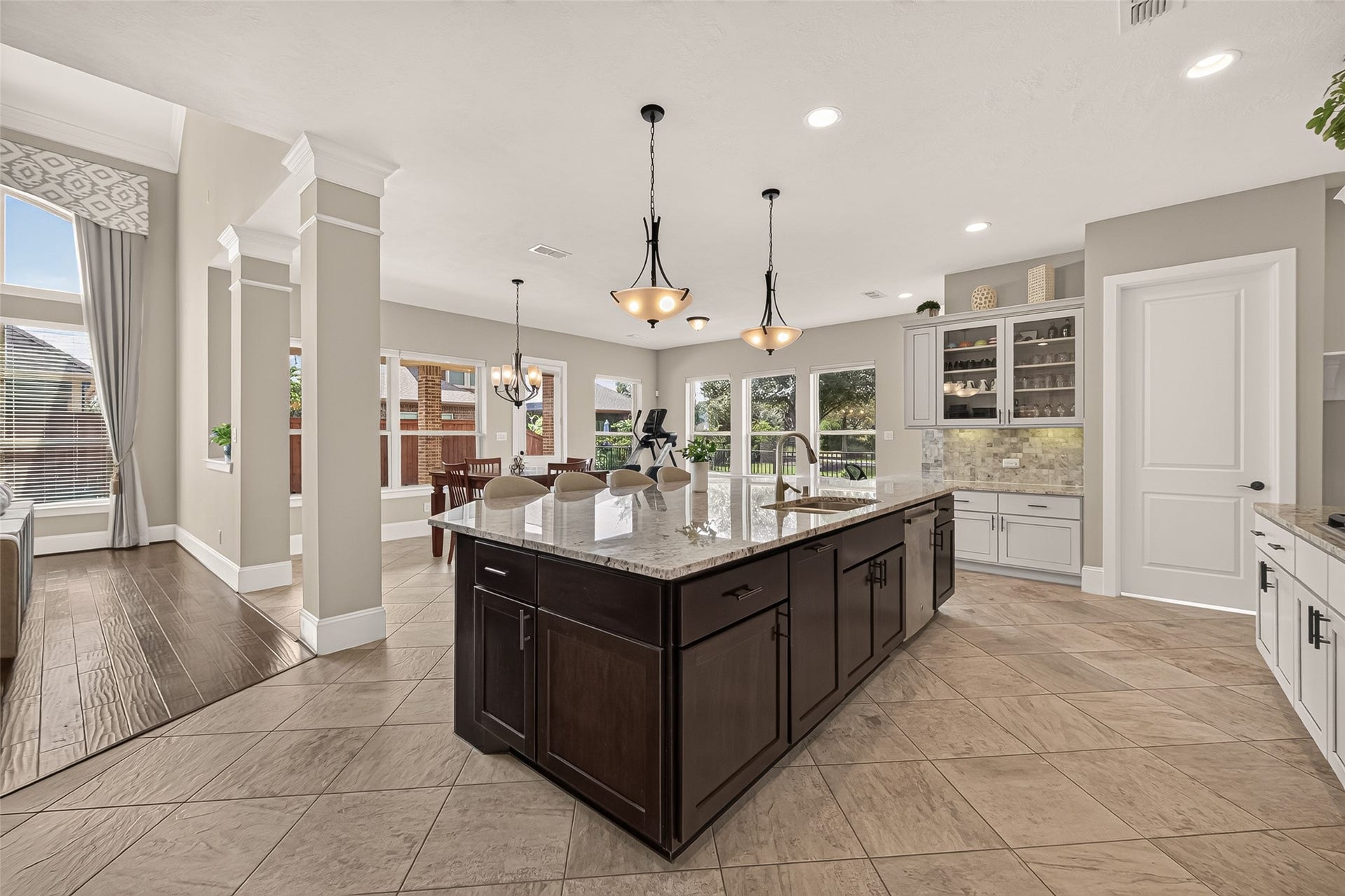 17811 Riata Prairie Lane, Cypress, TX 77433 Amazing Chefs Kitchen with granite countertops, SS Appliances, Double Oven, Walk-In Pantry and Large Island overlooking Breakfast nook and Lake