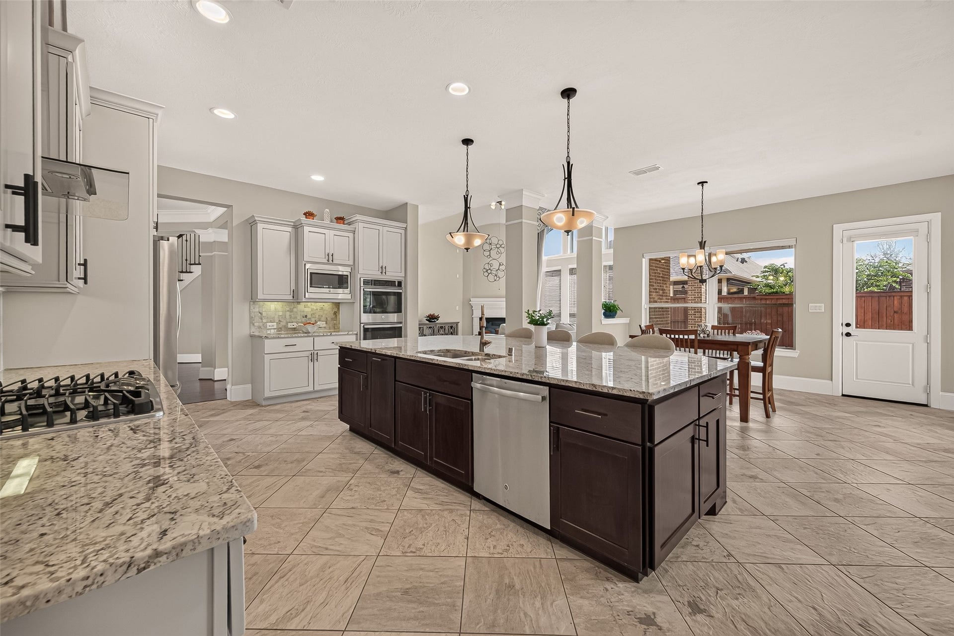 17811 Riata Prairie Lane, Cypress, TX 77433 Amazing Chefs Kitchen with granite countertops, SS Appliances, Double Oven, Walk-In Pantry and Large Island overlooking Breakfast nook and Lake