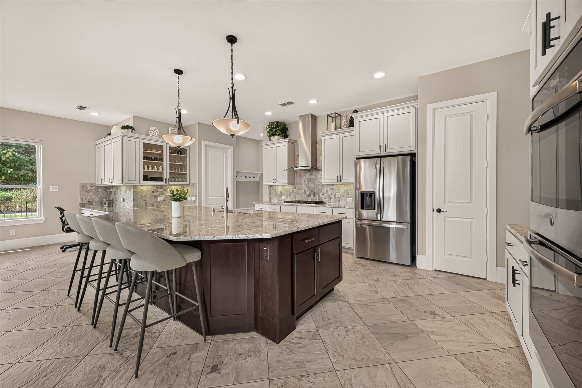 17811 Riata Prairie Lane, Cypress, TX 77433 Amazing Chefs Kitchen with granite countertops, SS Appliances, Double Oven, Walk-In Pantry and Large Island overlooking Breakfast nook and Lake