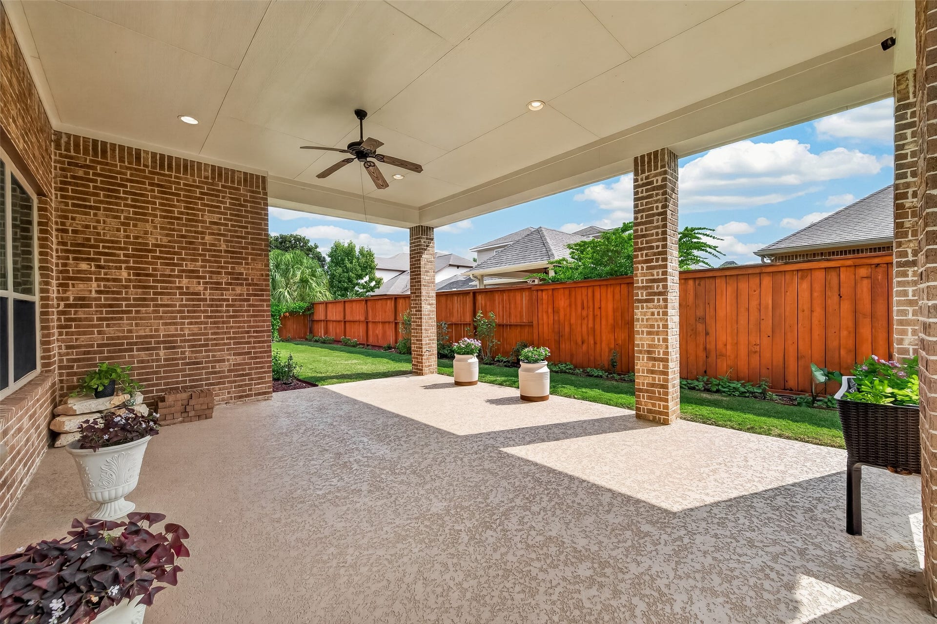 17811 Riata Prairie Lane, Cypress, TX 77433 Covered Back Patio with lush landscaping, gas hookup ready for outdoor kitchen