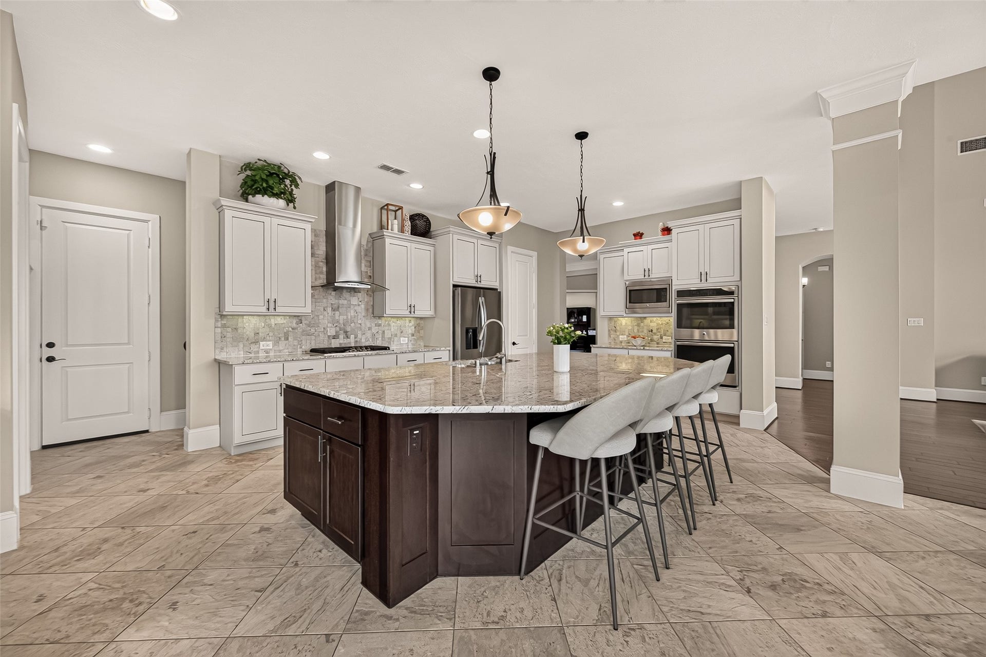 17811 Riata Prairie Lane, Cypress, TX 77433 Amazing Chefs Kitchen with granite countertops, SS Appliances, Double Oven, Walk-In Pantry and Large Island overlooking Breakfast nook and Lake