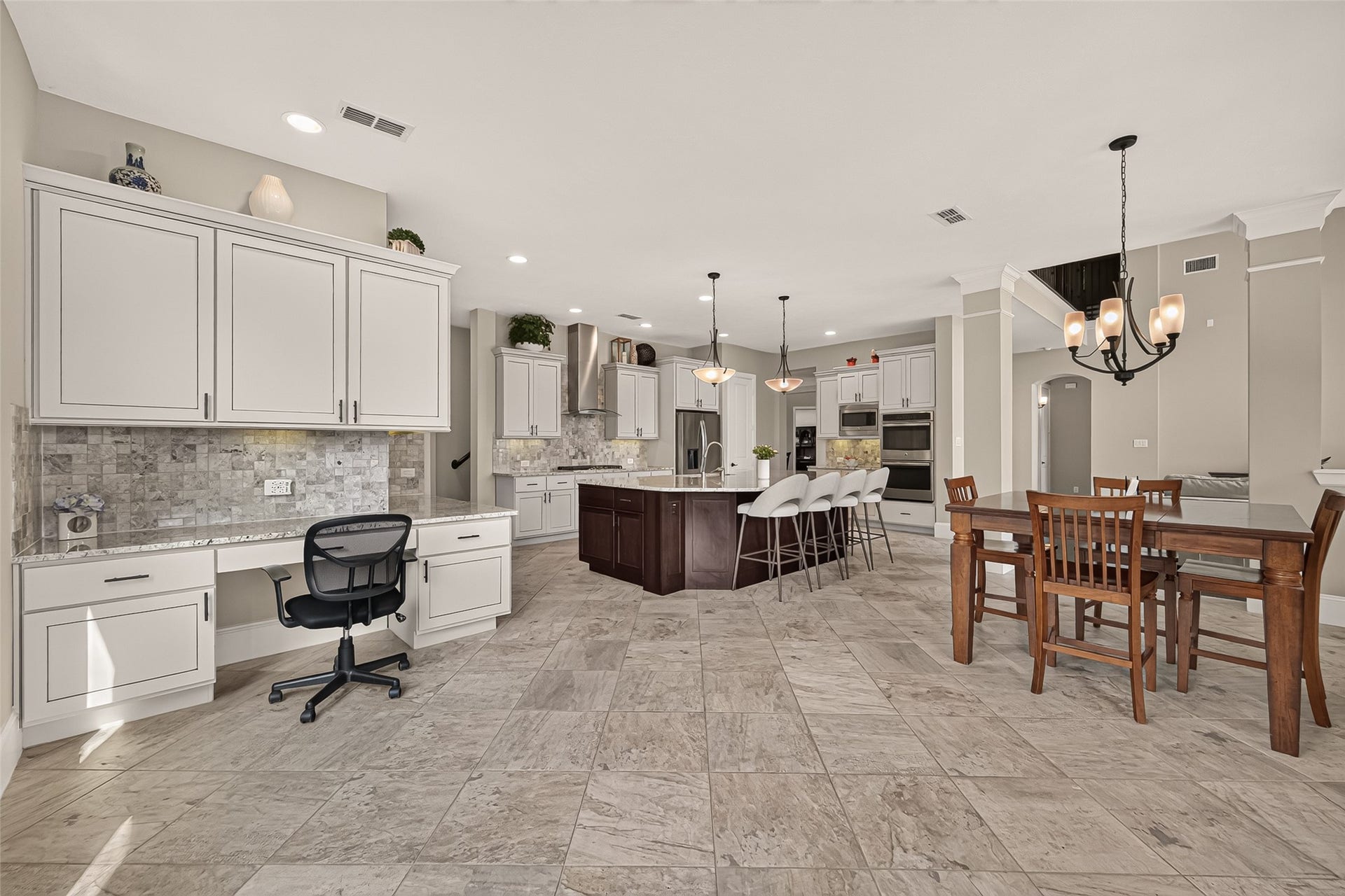 17811 Riata Prairie Lane, Cypress, TX 77433 Amazing Chefs Kitchen with granite countertops, SS Appliances, Double Oven, Walk-In Pantry and Large Island overlooking Breakfast nook and Lake