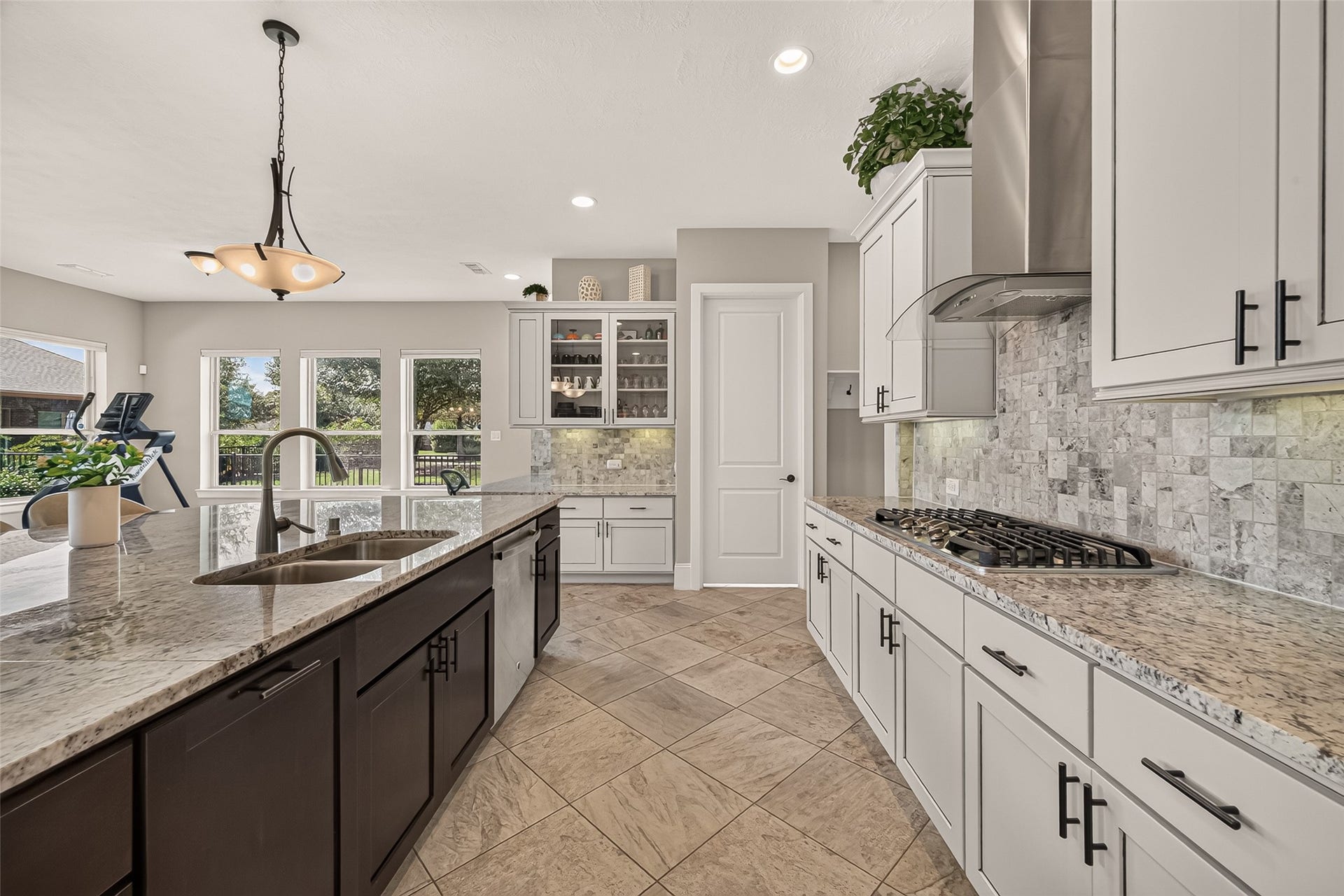 17811 Riata Prairie Lane, Cypress, TX 77433 Amazing Chefs Kitchen with granite countertops, SS Appliances, Double Oven, Walk-In Pantry and Large Island overlooking Breakfast nook and Lake