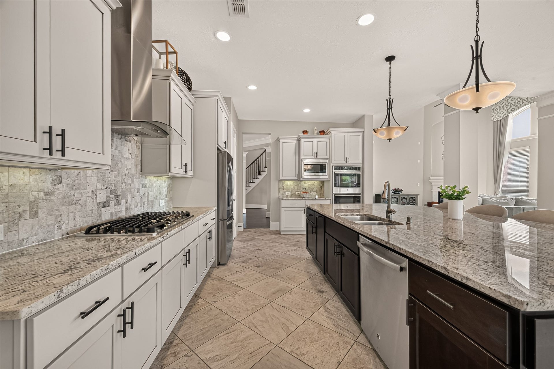 17811 Riata Prairie Lane, Cypress, TX 77433 Amazing Chefs Kitchen with granite countertops, SS Appliances, Double Oven, Walk-In Pantry and Large Island overlooking Breakfast nook and Lake
