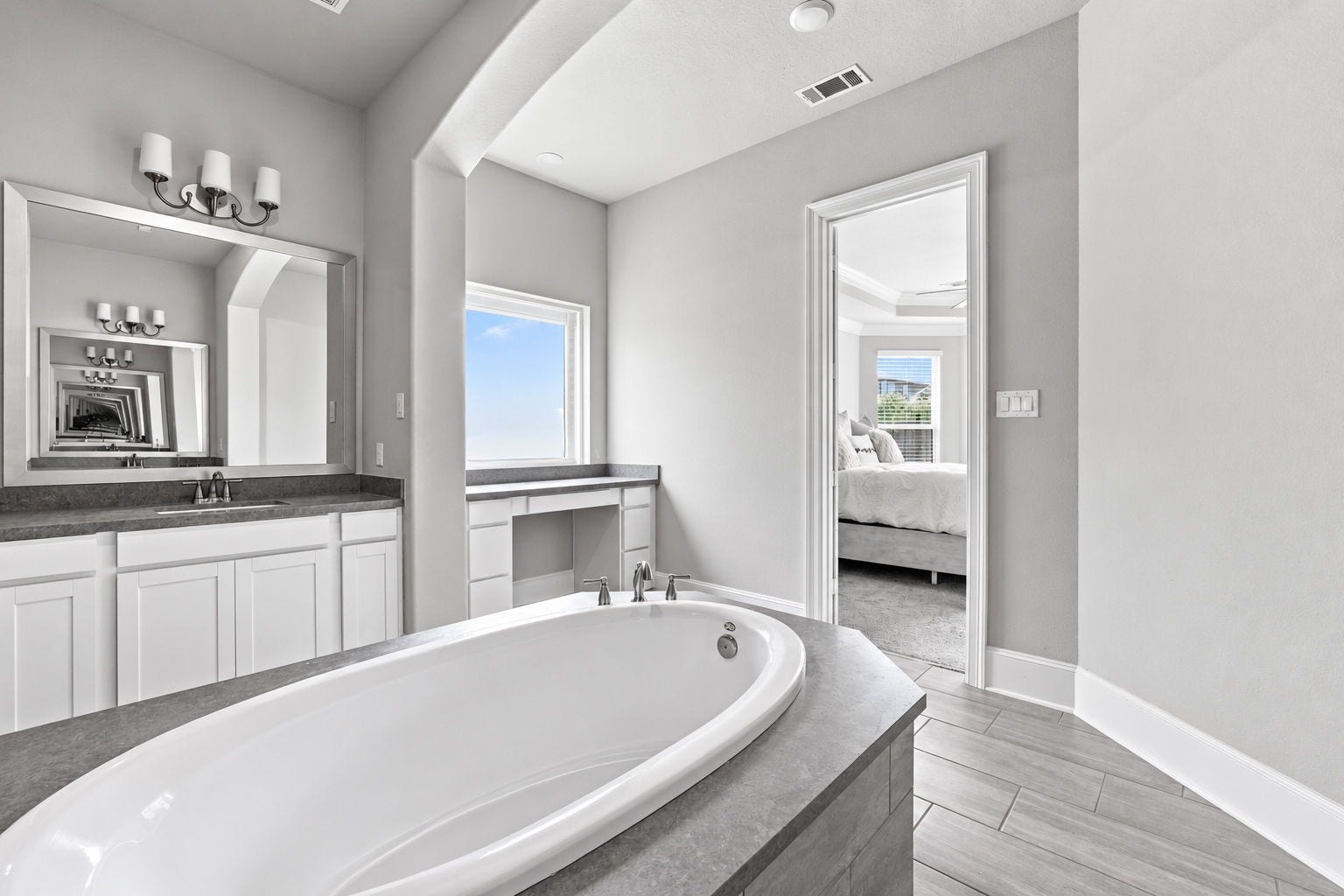 30719 Barred Owl Way, Fulshear, TX 77423 Separate vanities provide generous counter space and individual storage.
