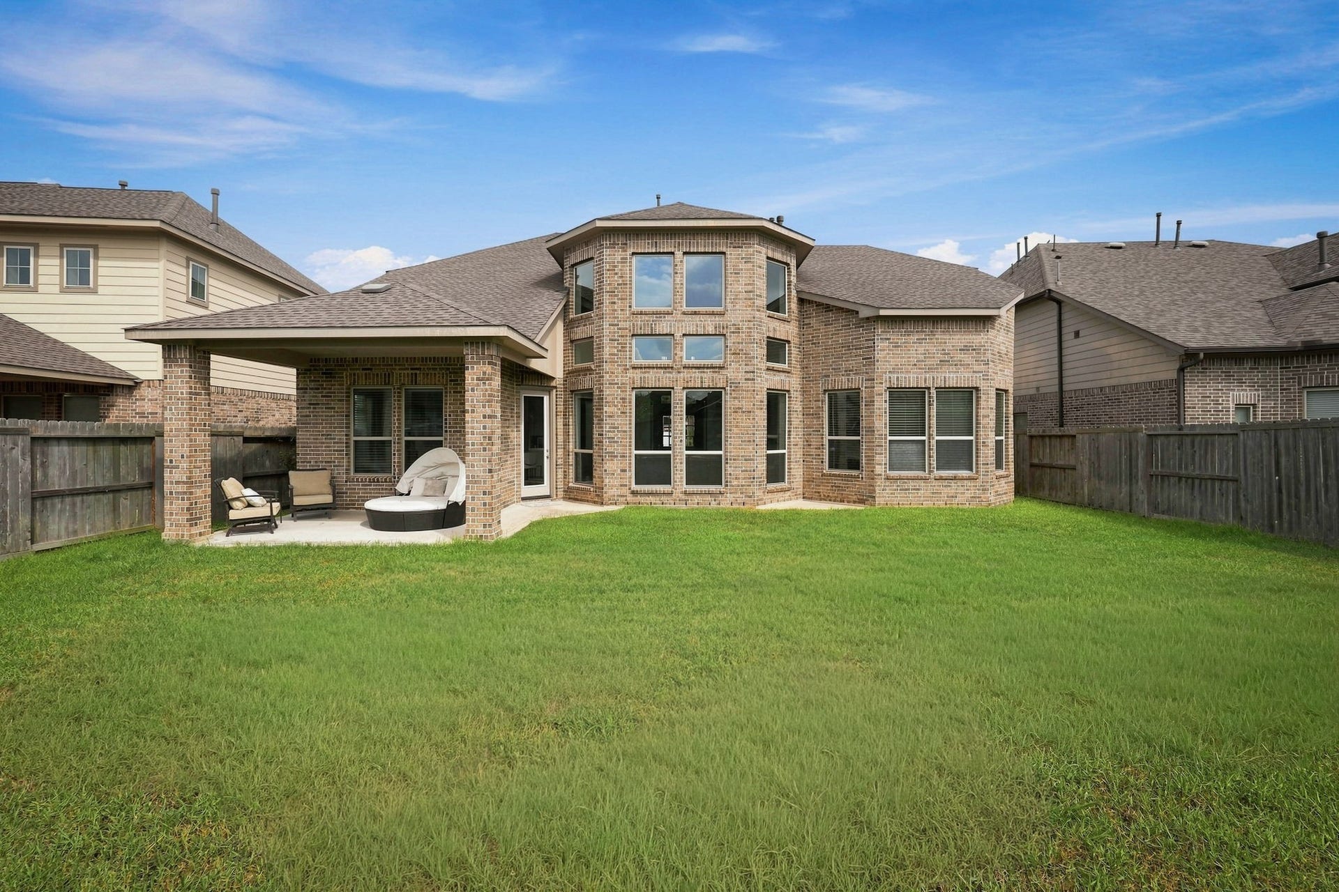 30719 Barred Owl Way, Fulshear, TX 77423 A spacious lawn provides room for outdoor activities, gardening, or future landscaping enhancements.