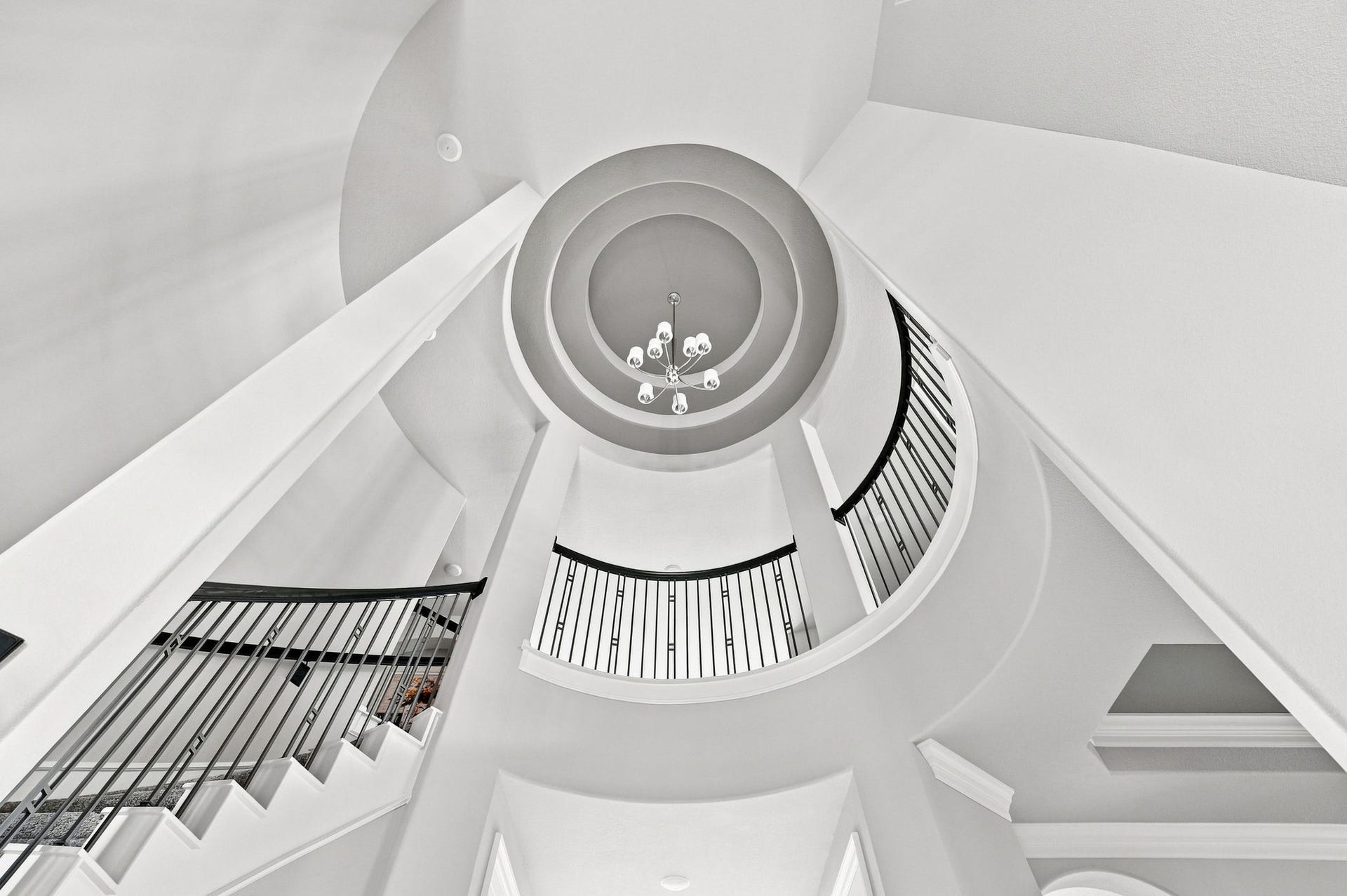 30719 Barred Owl Way, Fulshear, TX 77423 The magnificent circular ceiling design and chandelier create a stunning focal point above the foyer.