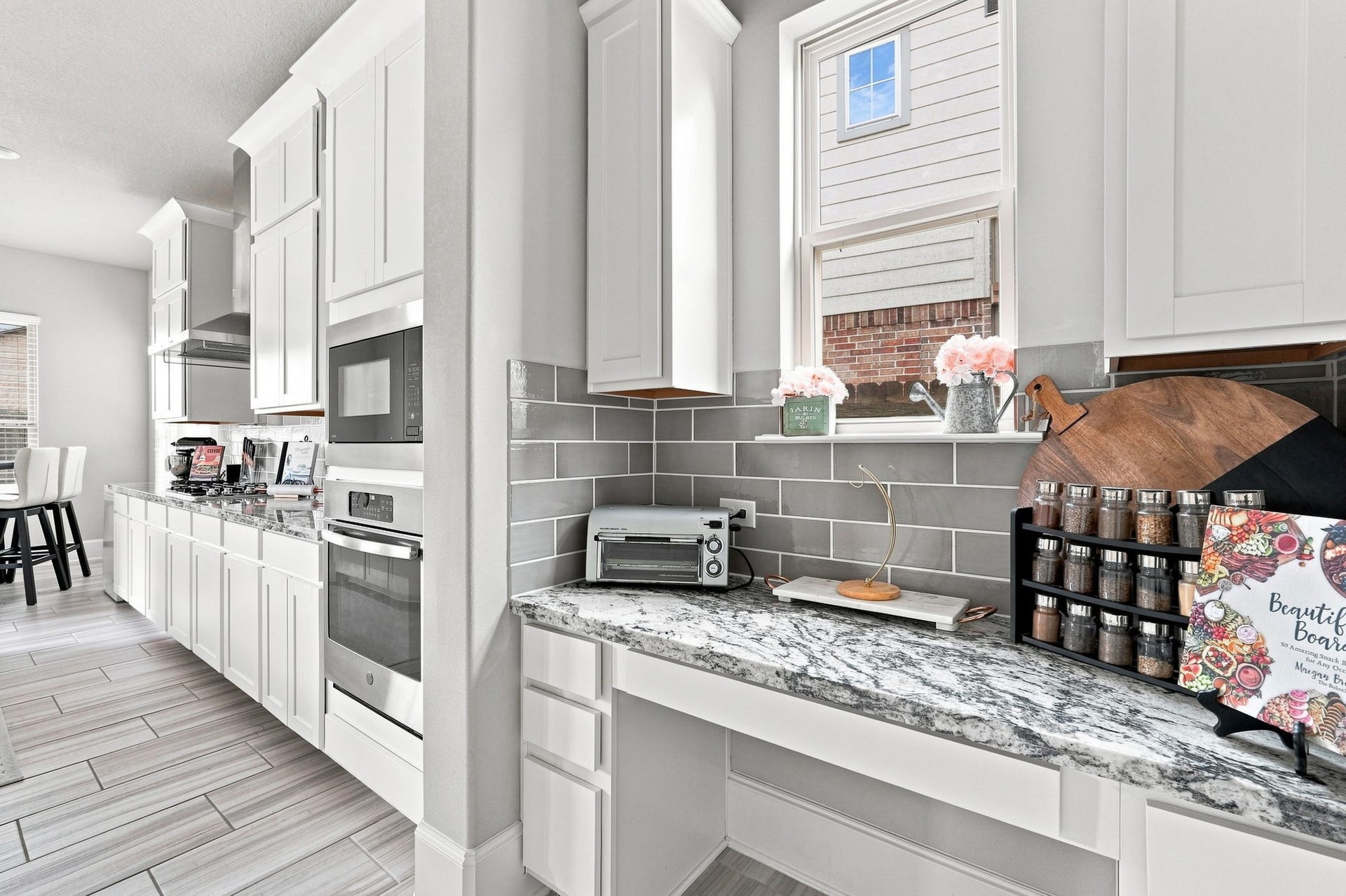 30719 Barred Owl Way, Fulshear, TX 77423 A dedicated planning area offers additional counter space and cabinetry just off the main kitchen.