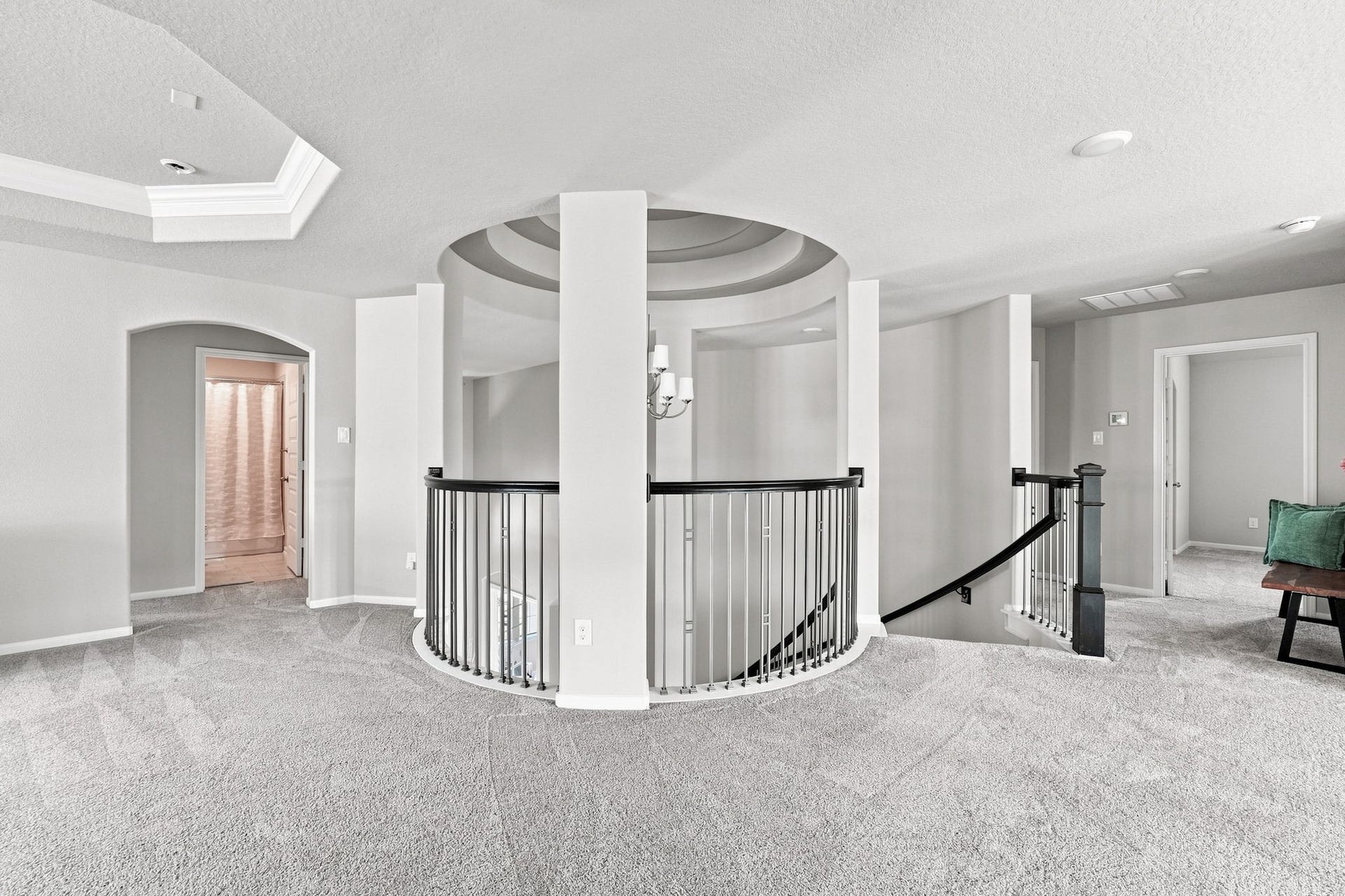 30719 Barred Owl Way, Fulshear, TX 77423 The upstairs landing offers a beautiful view of the grand foyer and its stunning architectural details.