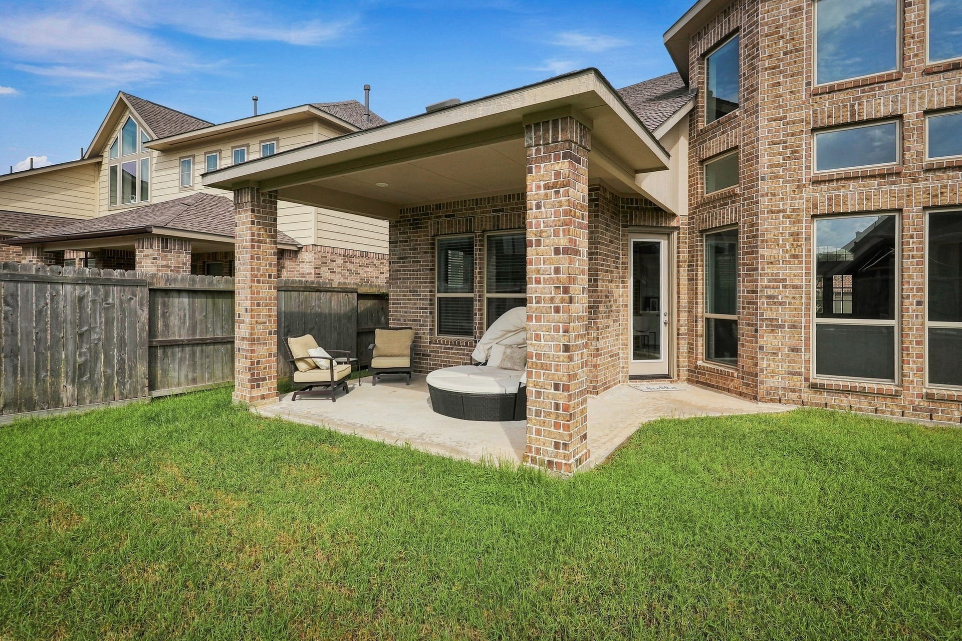 30719 Barred Owl Way, Fulshear, TX 77423 Enjoy the beautiful connection between the homes light-filled living spaces and the backyard.
