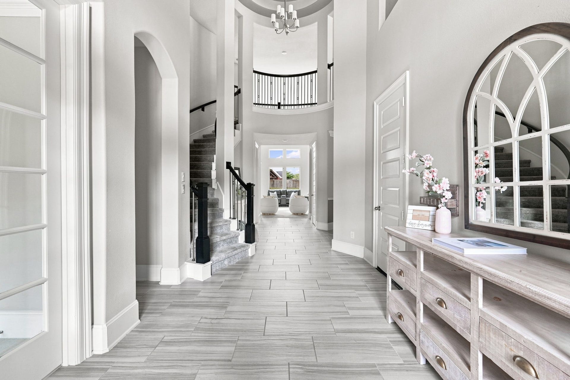 30719 Barred Owl Way, Fulshear, TX 77423 Step inside to a breathtaking two-story foyer where architectural beauty takes center stage.