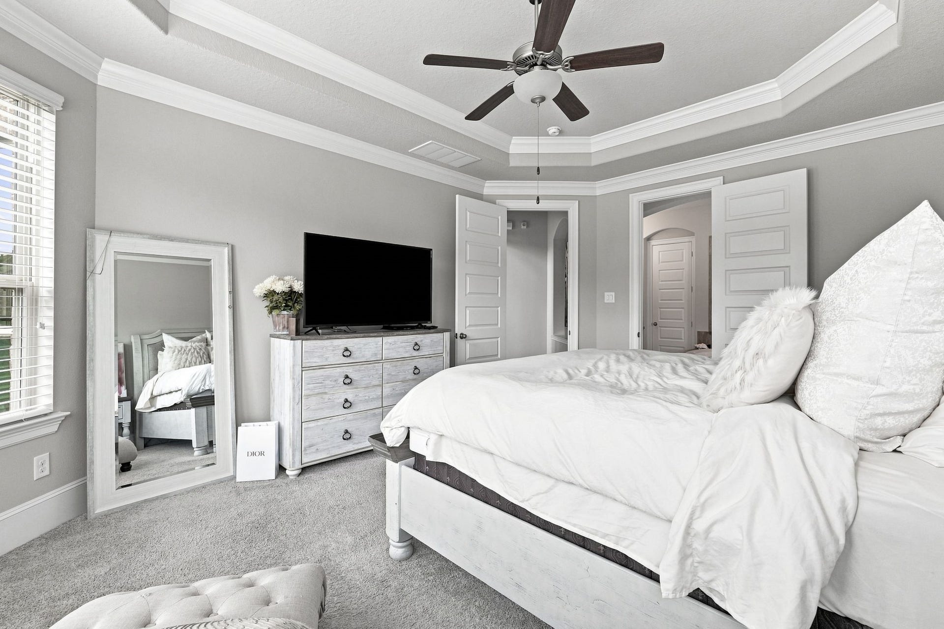 30719 Barred Owl Way, Fulshear, TX 77423 Soft neutral finishes and thoughtful architectural details create a serene setting at the end of the day.