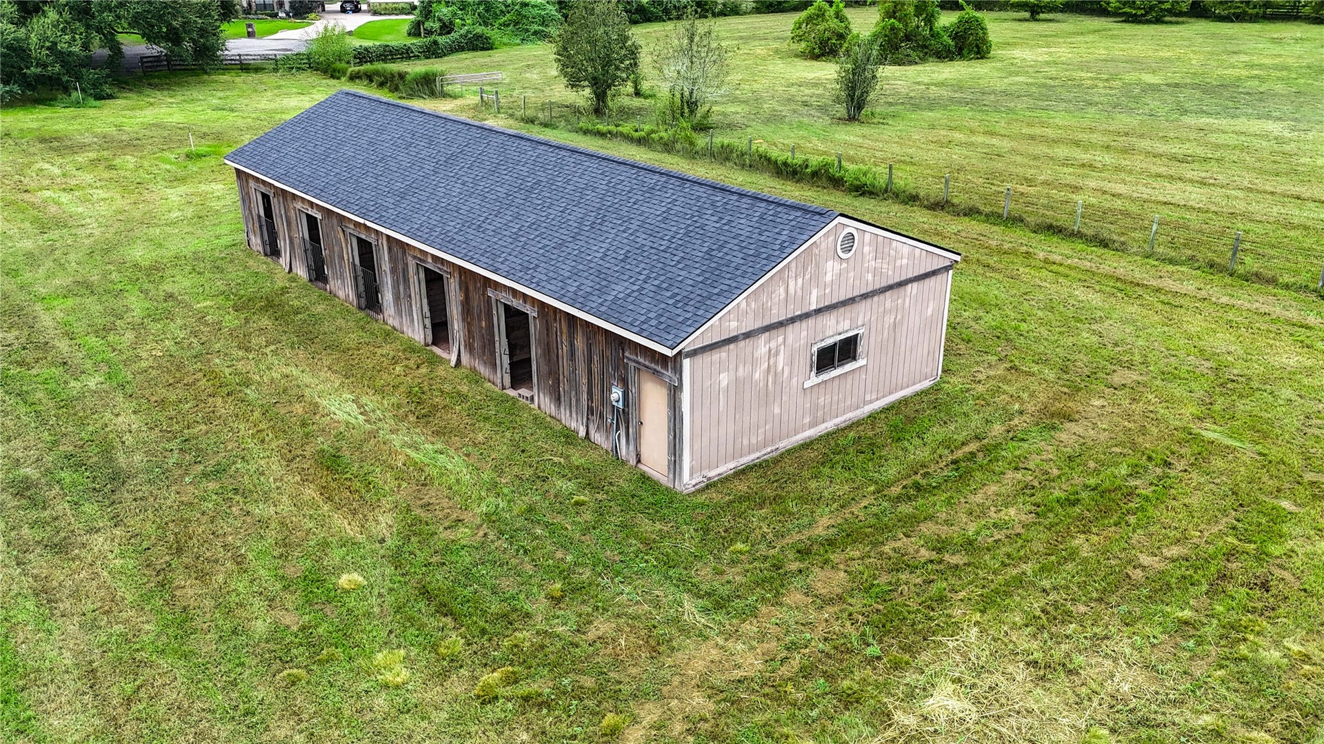 Situated alongside the home this 5 stall barn, set amidst lush, open fields offers ample space for livestock or storage. The back part of the barn is in need of renovation but has featured a full bathroom and additional storage space.