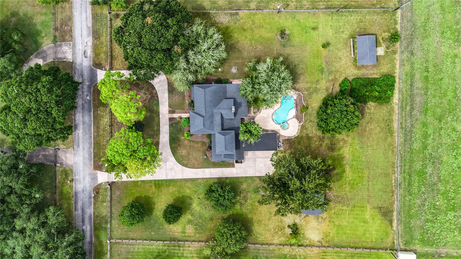 Featuring a charming home, a winding driveway, and a sparkling pool, this home is ideal for those seeking privacy and outdoor enjoyment.