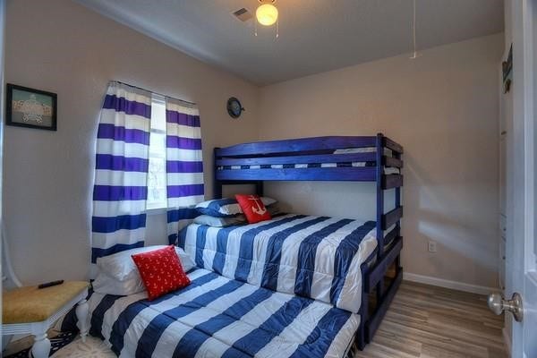 secondary bedroom with triple bunks. 2 Twin XL beds and a queen
