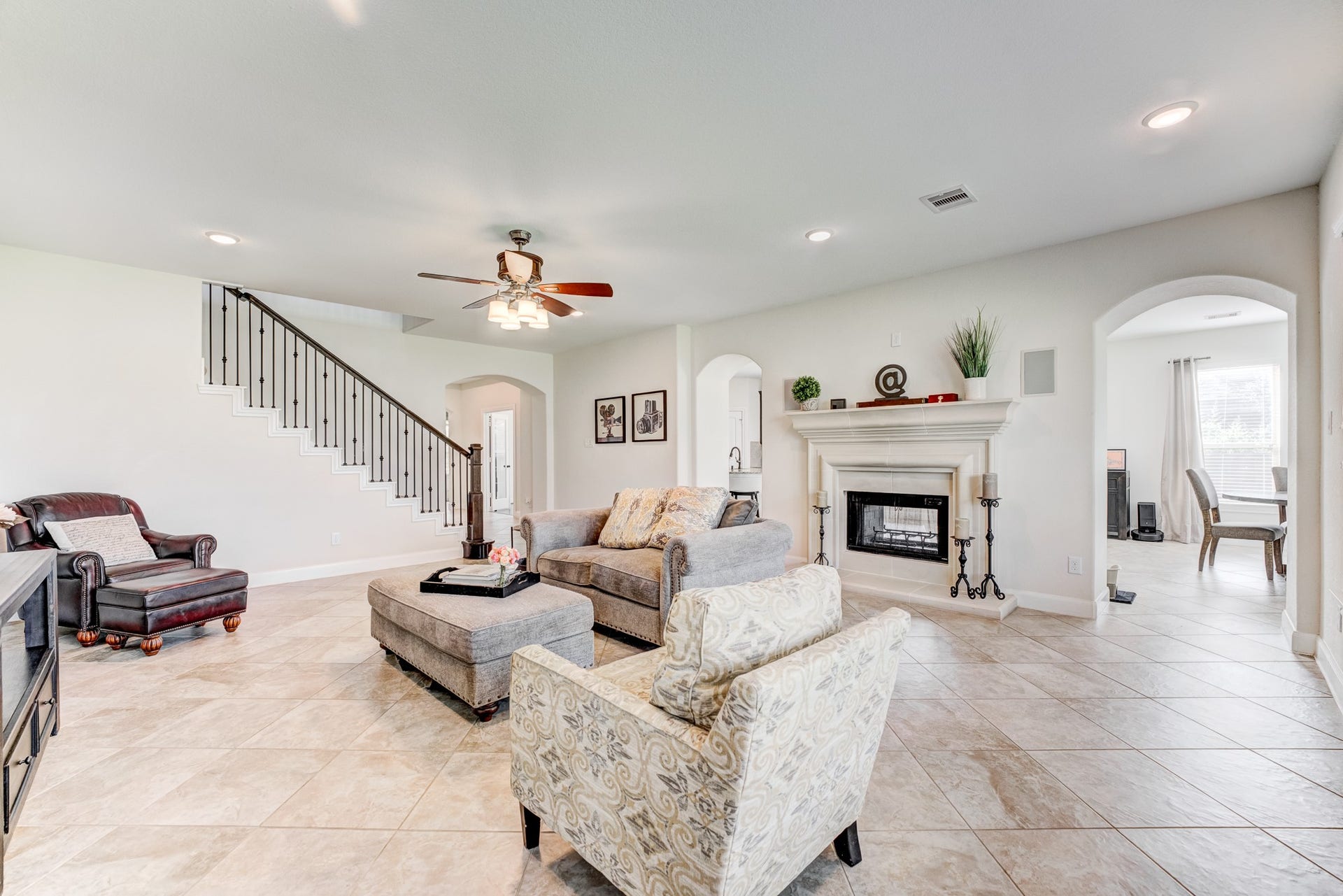 13502 Sorghum Drive, Rosharon, TX 77583 Family room with double-sided fireplace