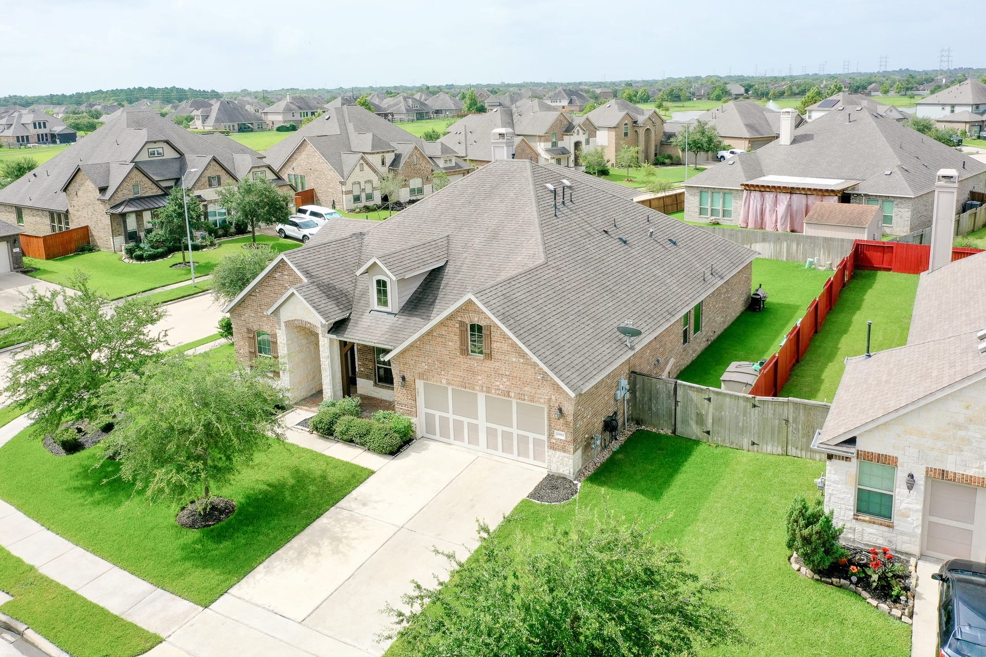 13502 Sorghum Drive, Rosharon, TX 77583 Aerial view of the home and corner lot