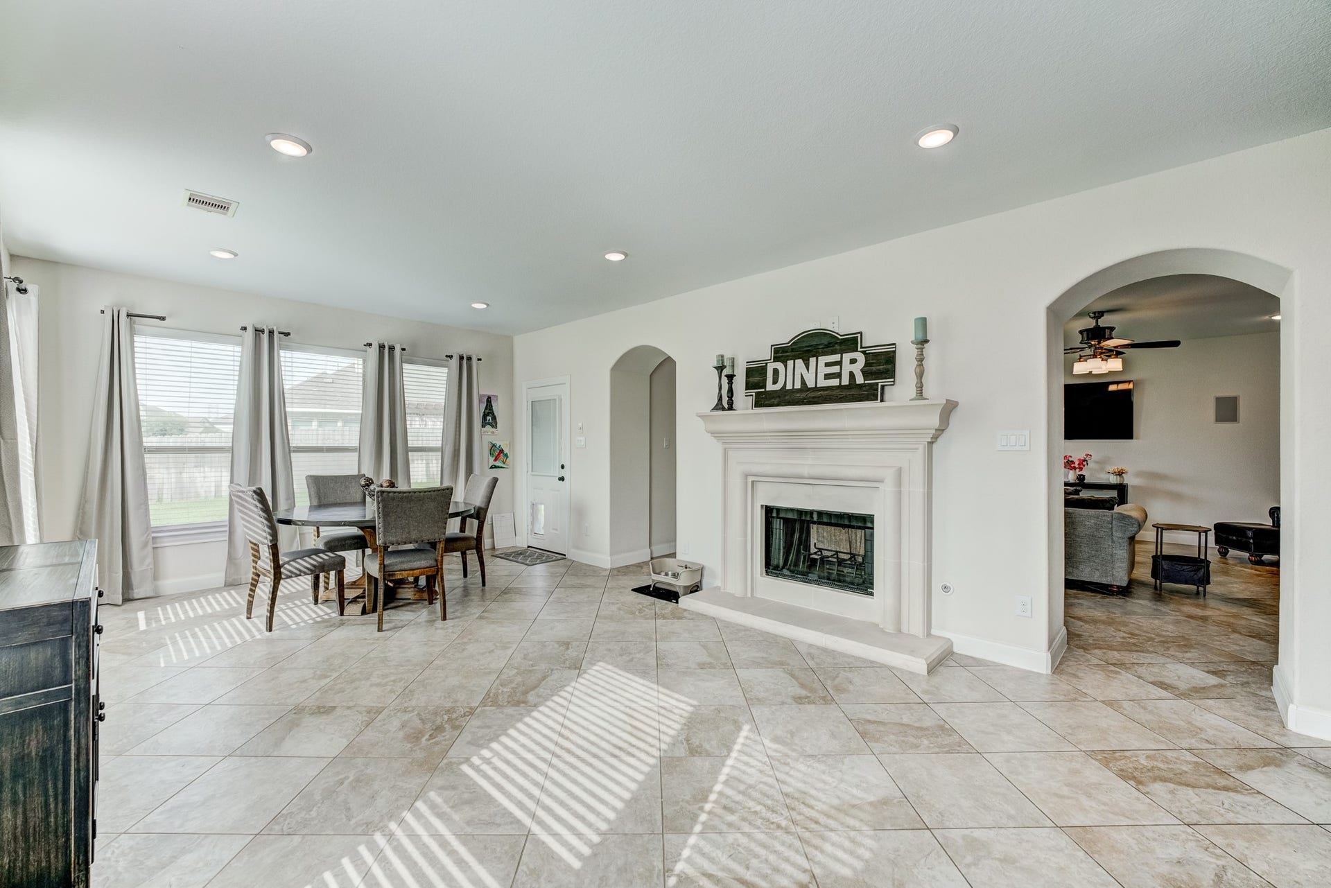 13502 Sorghum Drive, Rosharon, TX 77583 Dining room with double-sided fireplace