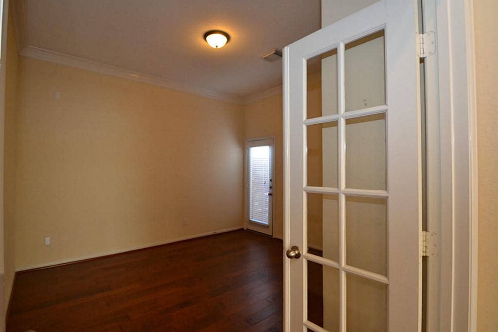 6606 Cadogan Court, Sugar Land, TX 77479 Study with a French door Property is in Excellent condition. Hardly been Lived in. 3 bedroom plus a study that can be used as a 4th bedroom. Wood floors through-out.