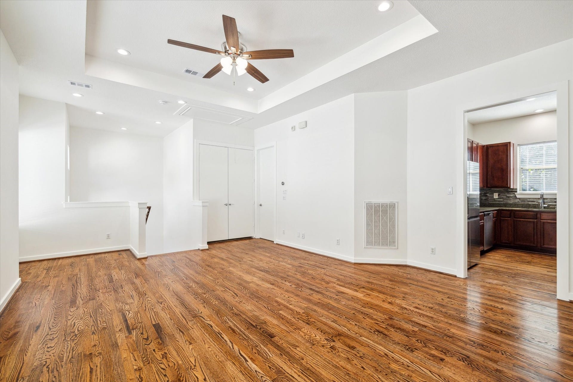 4046 Center Street, Houston, TX 77007 Another view of the living area and a glimpse into the kitchen.