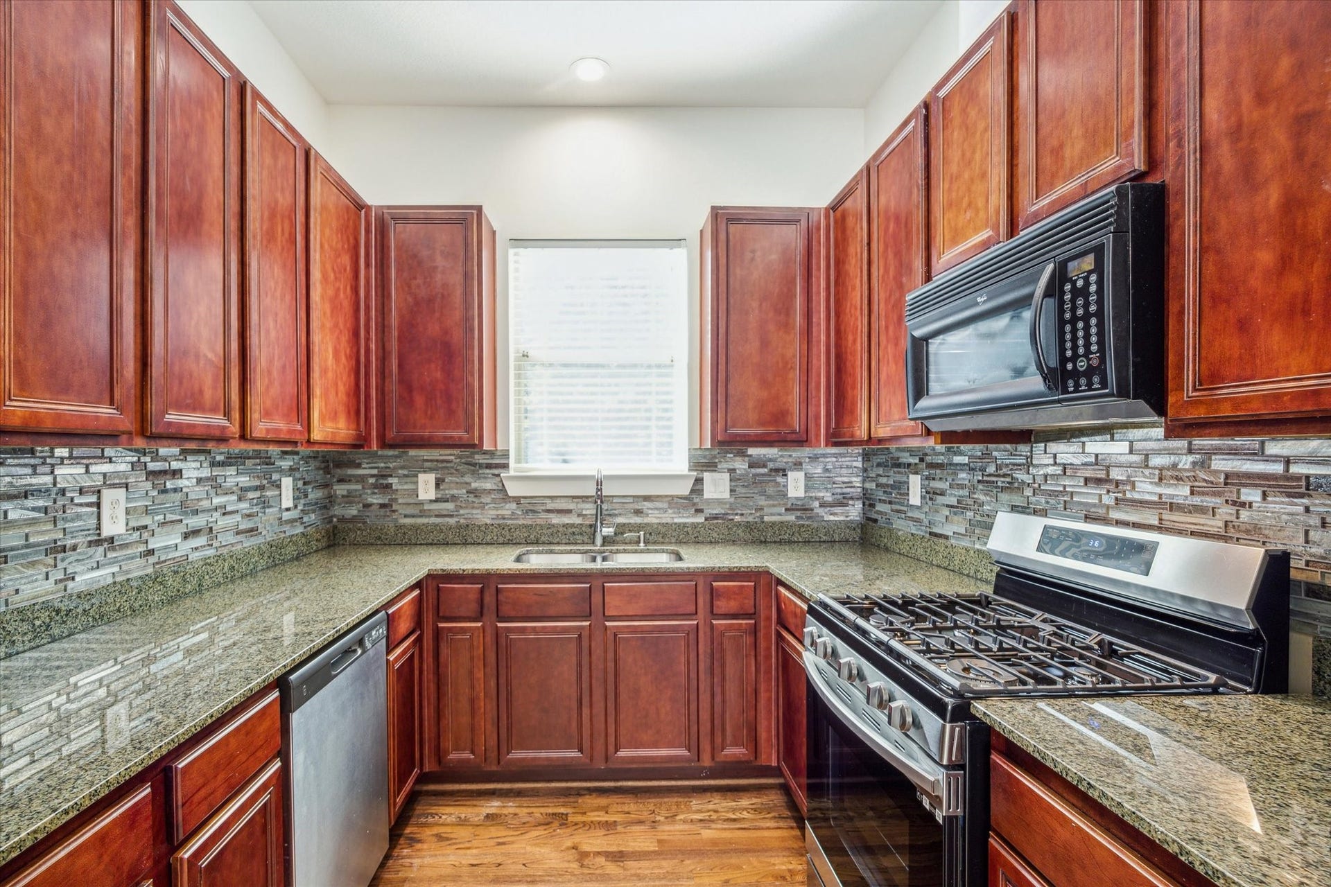 4046 Center Street, Houston, TX 77007 Great kitchen with gas cooking, plenty of storage and updated refrigerator and pantry (not shown in this photo).