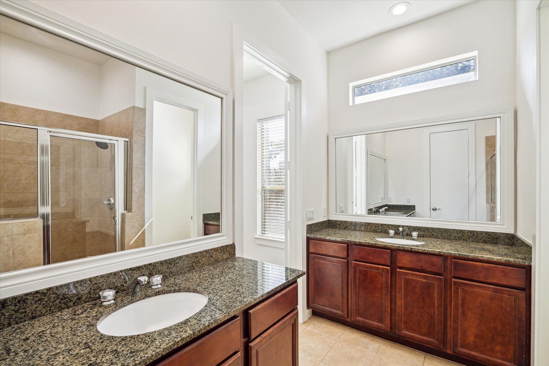 4046 Center Street, Houston, TX 77007 Separate vanities with granite counters and ample storage. There is also a separate water closet.