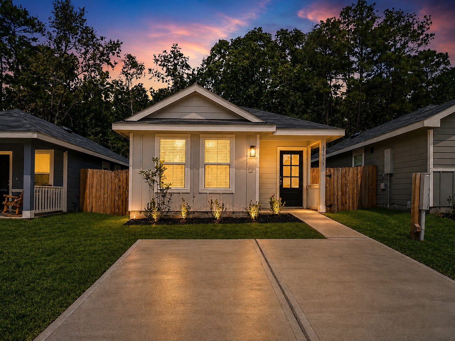 11935 Detar Court, Willis, TX 77378 Charming single-story home featuring a welcoming covered entry, attractive landscaping, and warm exterior lighting.