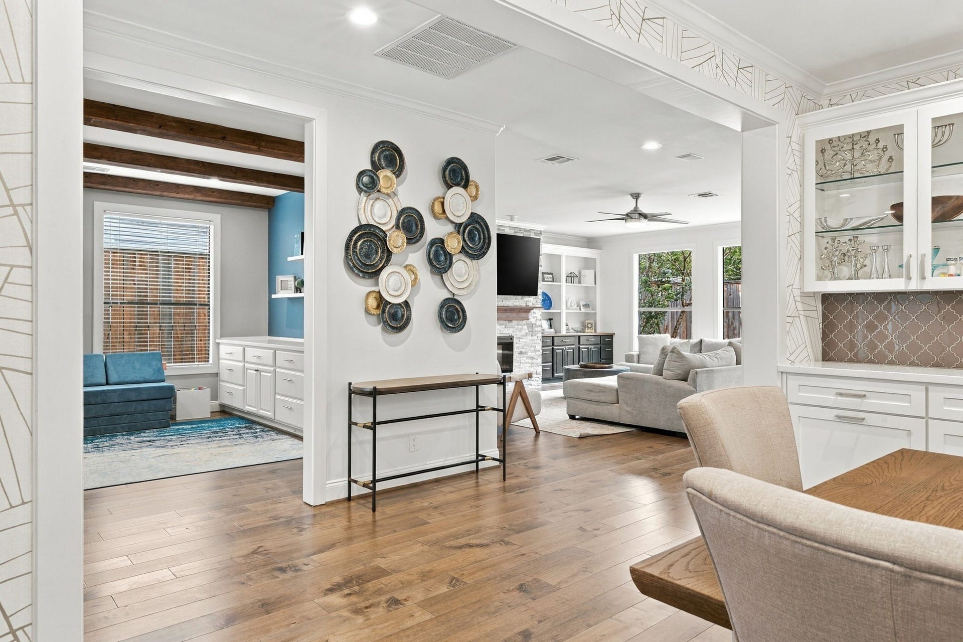 Wonderful open floor plan creates a seamless flow between the formal dining room, versatile first-floor home office/bedroom & spacious living room. Beautiful hardwood floors extend throughout, connecting these inviting spaces.