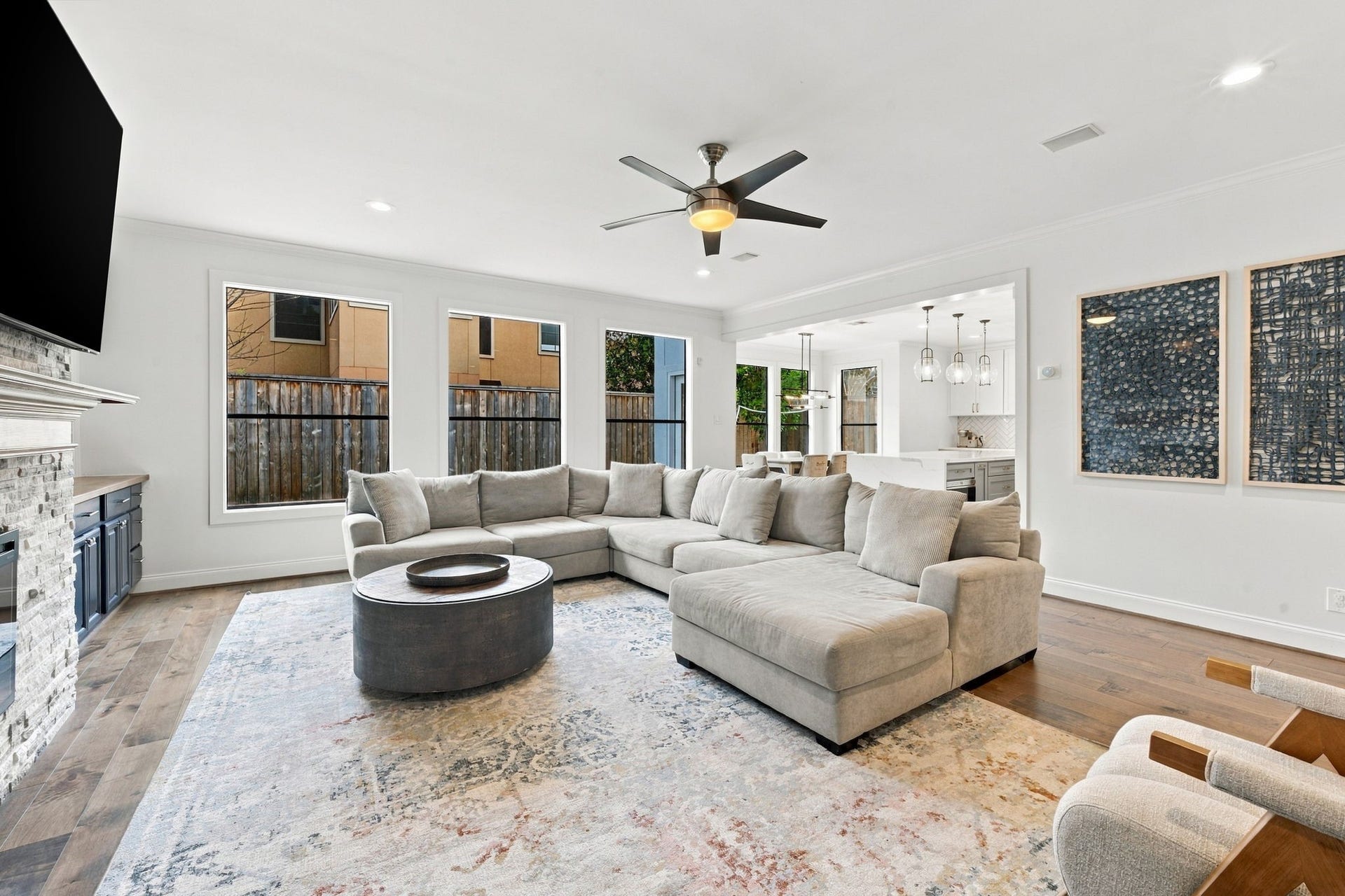 A wonderful perspective showcasing the generous living area, easily accommodating large sectional seating. The open layout flows seamlessly into the kitchen & breakfast area, creating an ideal setting for everyday living, entertaining & spending time together.