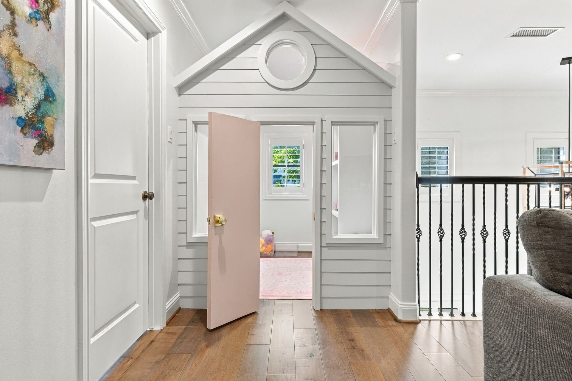 Adorable custom built-in dollhouse located just off the upstairs game room! Designed to resemble a miniature home w/its own roofline, windows & entry door, creating a fun & imaginative play space.