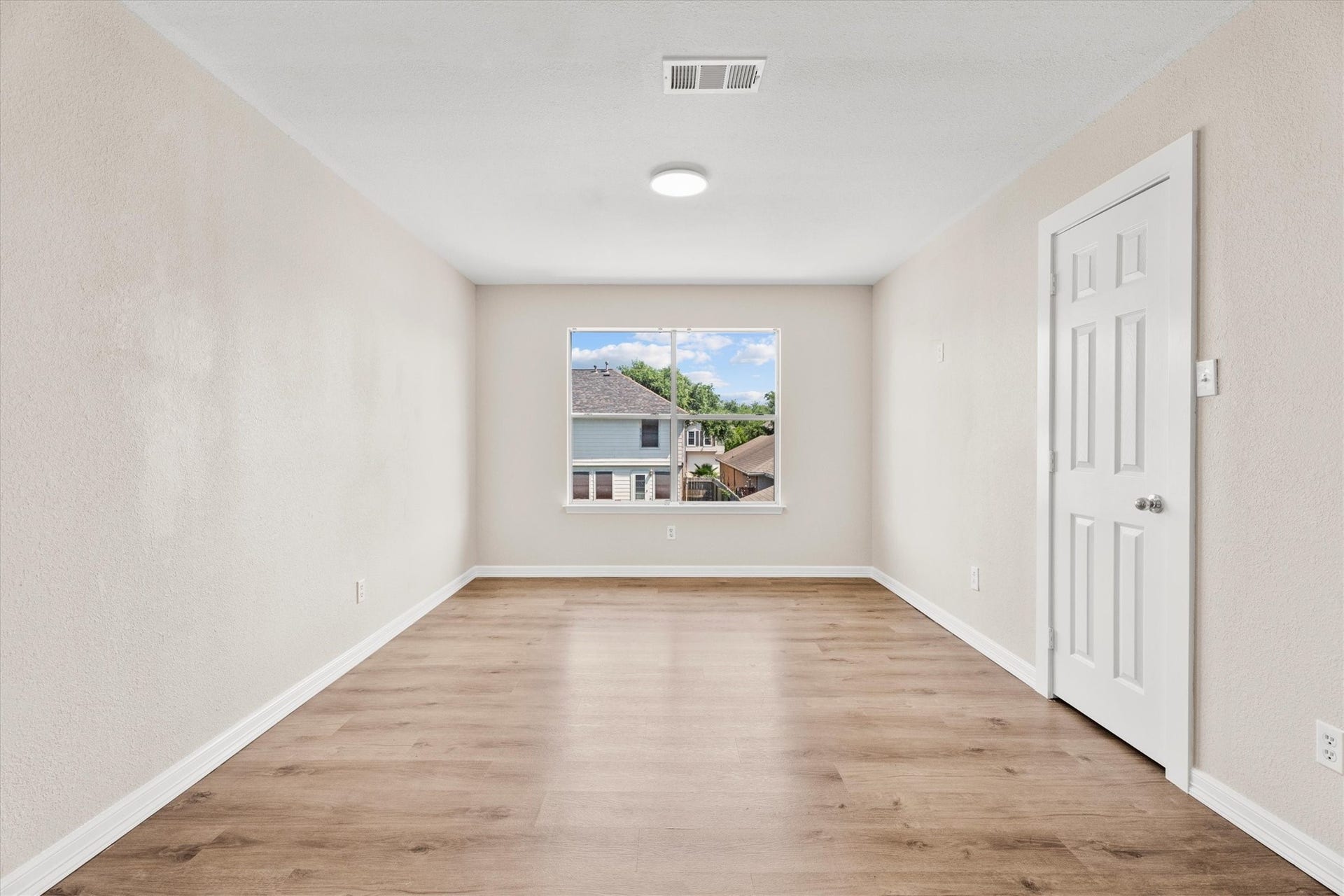 5918 Stirring Winds Lane, Houston, TX 77086 Versatile second-floor gameroom, loft, or flex space featuring durable flooring and a storage closet.