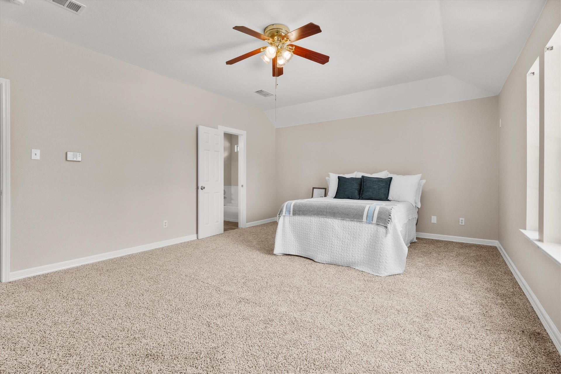 5918 Stirring Winds Lane, Houston, TX 77086 Generous primary retreat with plenty of space for oversized furniture and an ensuite bath.