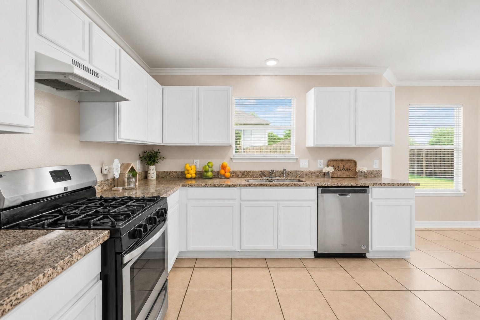 5918 Stirring Winds Lane, Houston, TX 77086 Enjoy plenty of prep space and natural light in this well-appointed kitchen designed for both functionality and convenience.