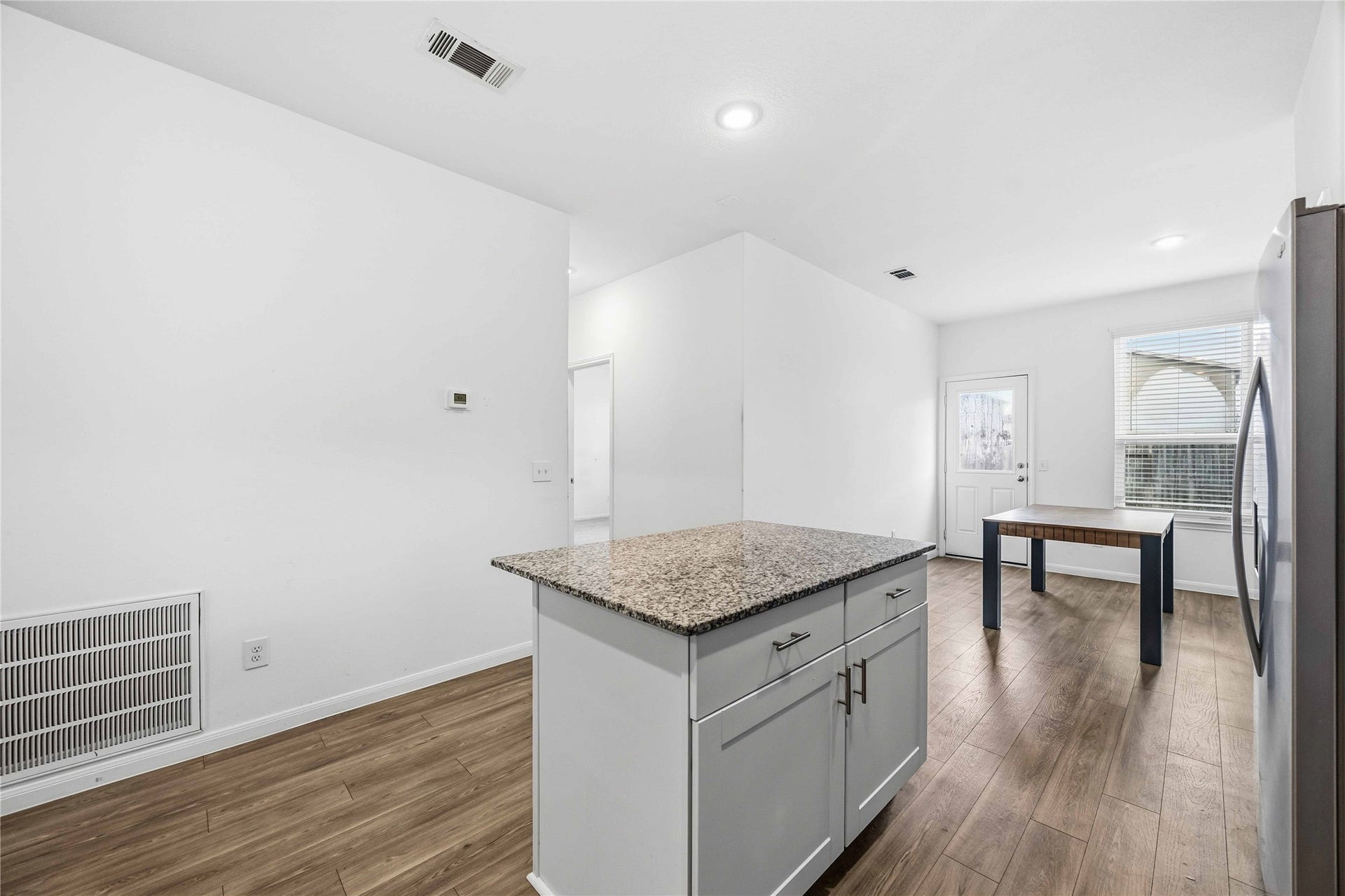 Open kitchen layout flows into the breakfast area.