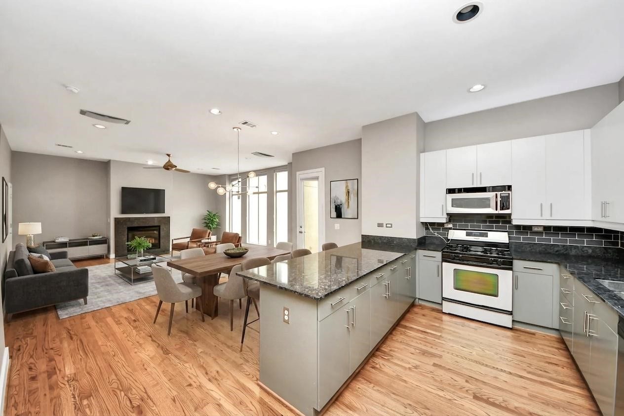 1112 Columbus Street, #B, Houston, TX 77019 **Virtually staged open-concept living and dining room located on the second floor.