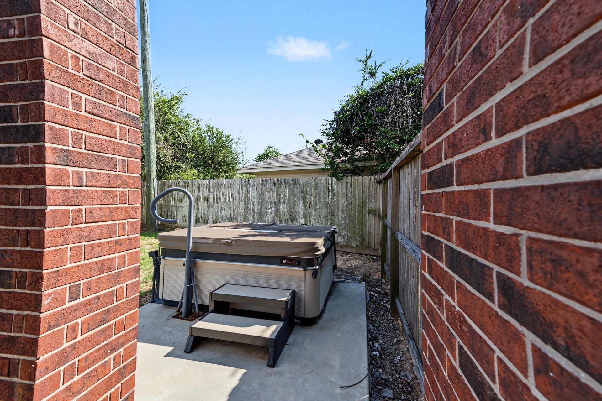 Enjoy relaxation with a hot tub conveniently located right outside the primary suite for easy access.