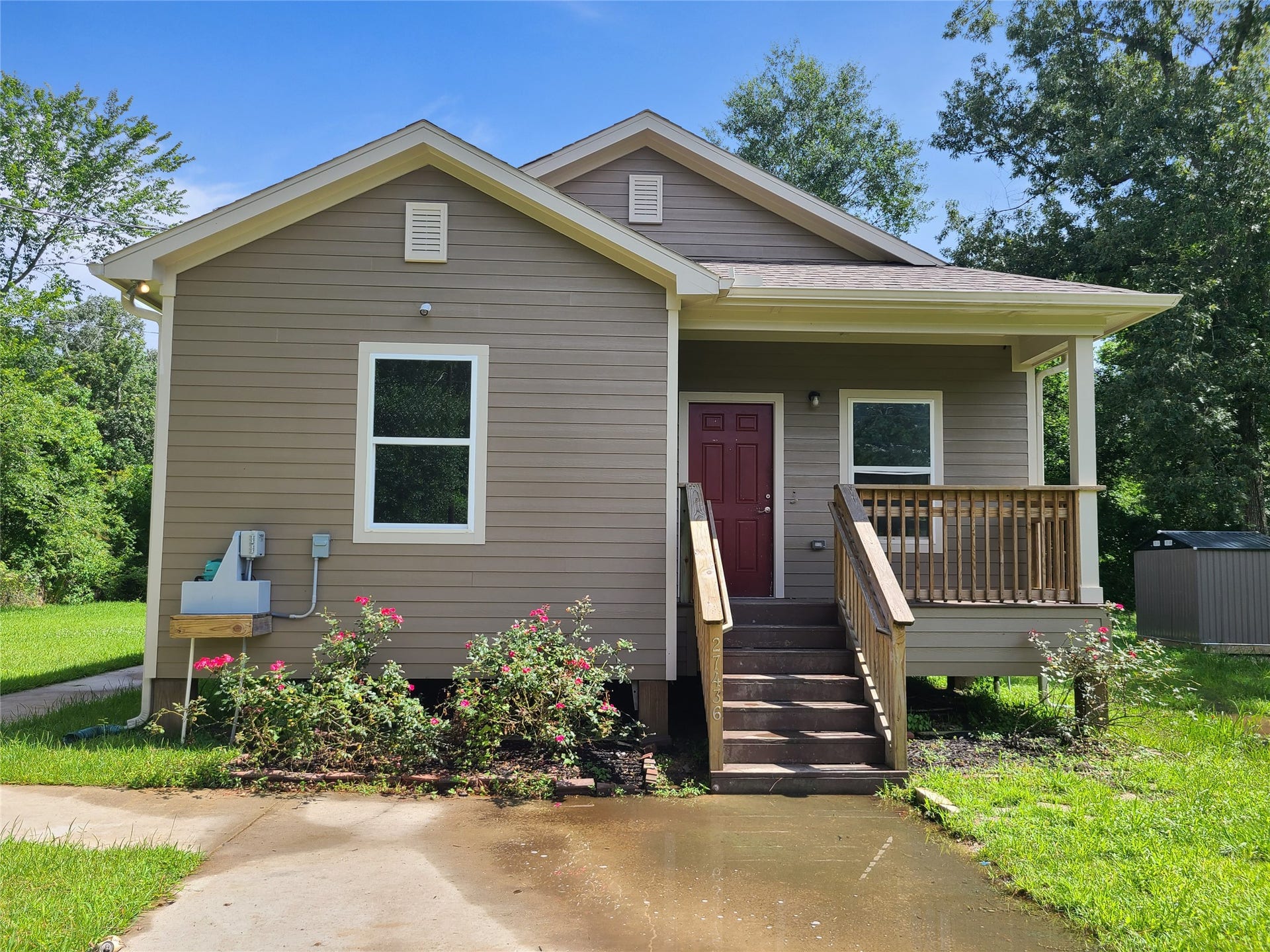 Front view with covered porch.