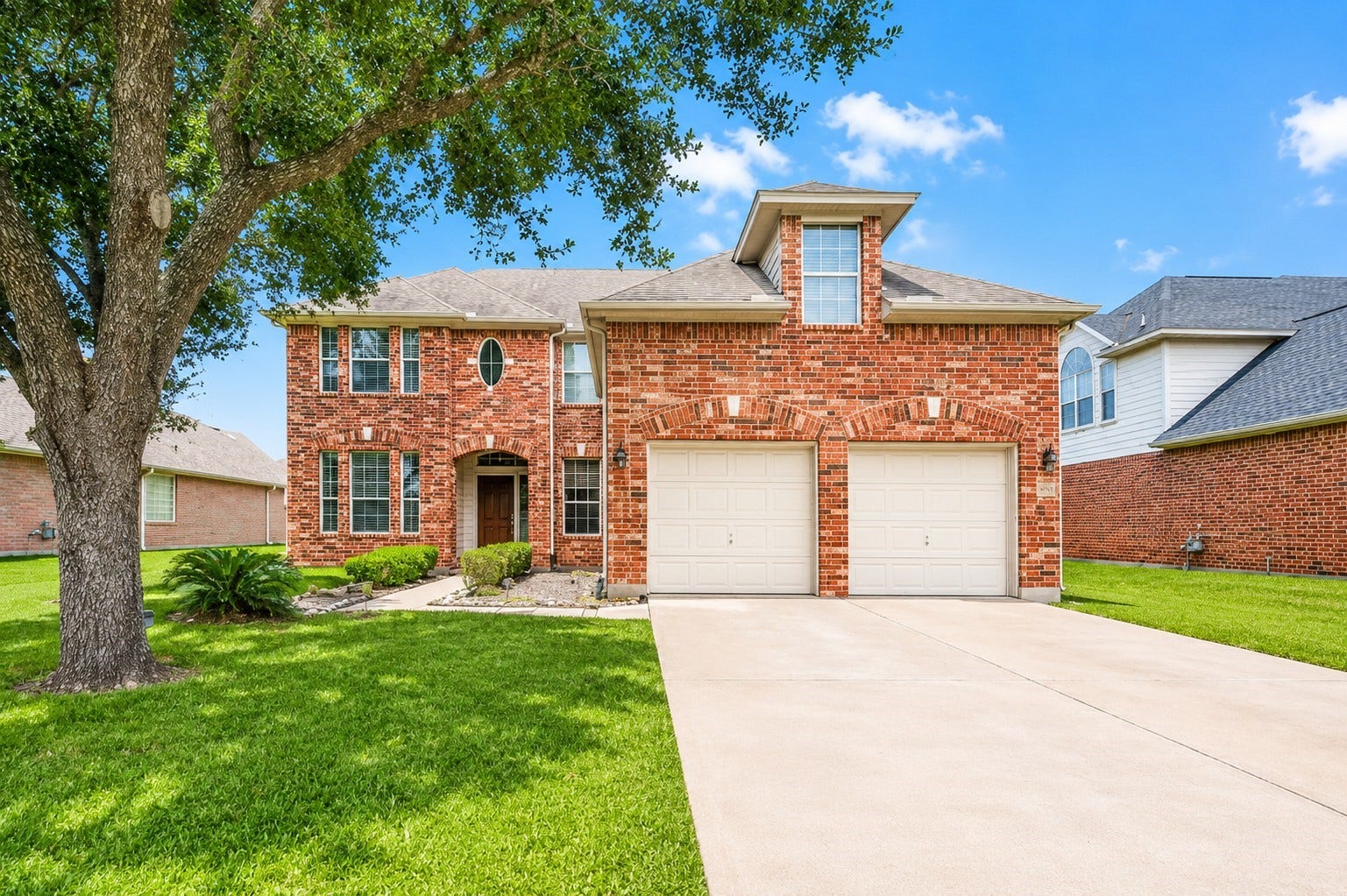 4026 Aerial Brook Trail, Fresno, TX 77545 Beautiful two-story brick home with mature trees, great curb appeal, and a spacious two-car garage.