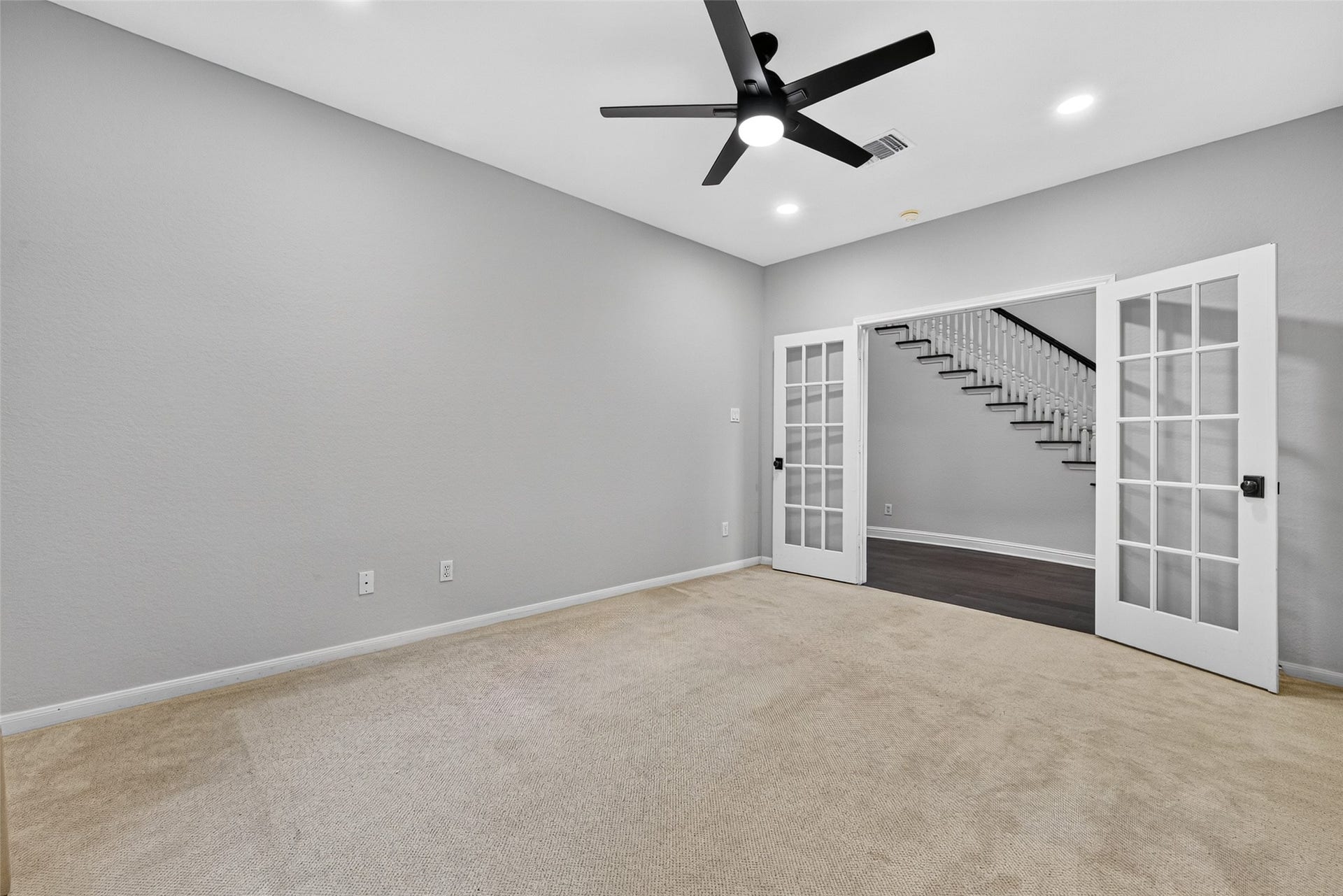 7707 Stone Arbor Drive, Sugar Land, TX 77479 A ROOM WITH SO MANY POSSIBILITIES! Located on the first floor, this spacious Study features French doors, a ceiling fan with light, recessed lighting & neutral finishes. Whether you're looking for a private home office, a comfortable guest bedroom, a quiet reading retreat or an additional television room, this versatile space can easily adapt to your needs. With a full bath conveniently located nearby, it also offers the flexibility to serve as Bedroom #4.