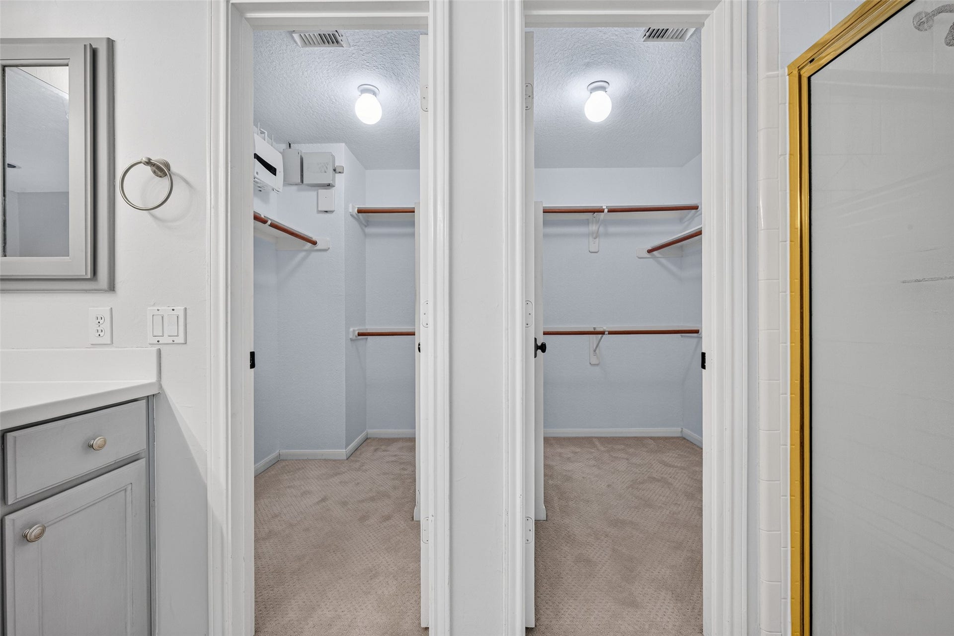 7707 Stone Arbor Drive, Sugar Land, TX 77479 TWO WALK-IN CLOSETSDOUBLE THE POSSIBILITIES! The Primary Bath includes two separate walk-in closets, each with hanging rods & shelving for organizing clothing, shoes & accessories. Having individual closet spaces makes it easier to keep wardrobes organized, with room for everyday essentials as well as seasonal clothing. A practical convenience that adds to the comfort & functionality of the upstairs Primary Suite.