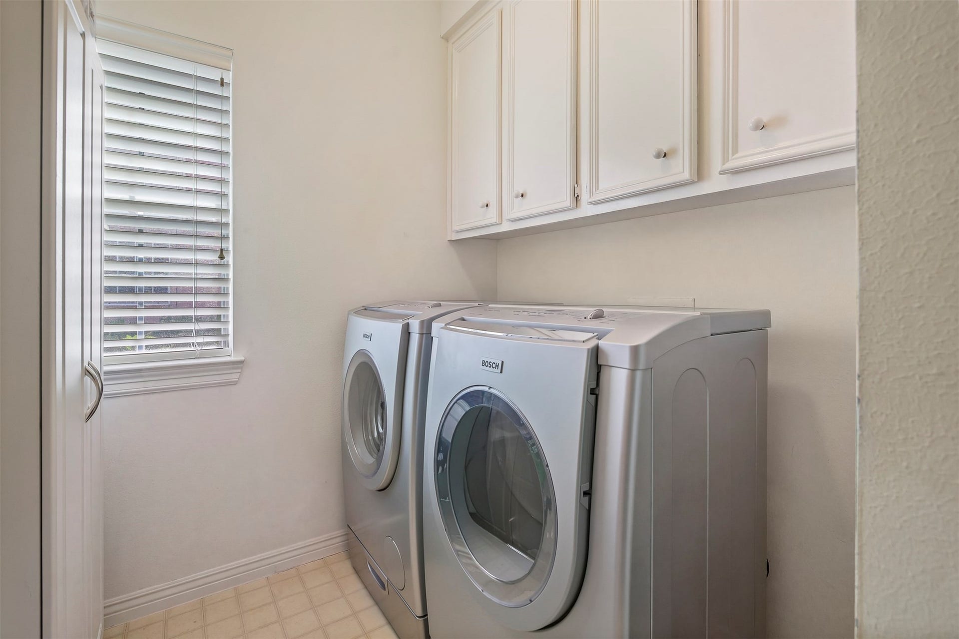 1414 Forest Bend, Sugar Land, TX 77479 Utility room features built in cabinets for extra storage.