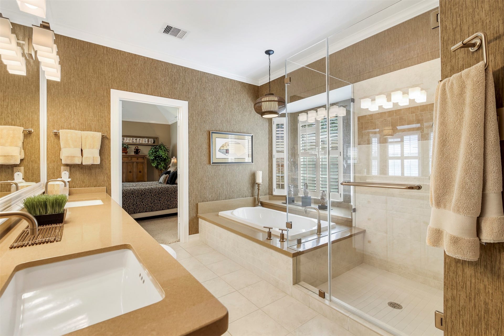 1414 Forest Bend, Sugar Land, TX 77479 The primary bathroom features a separate soaking tub with quartz surround, and large frameless glass walk in shower with bench seat.