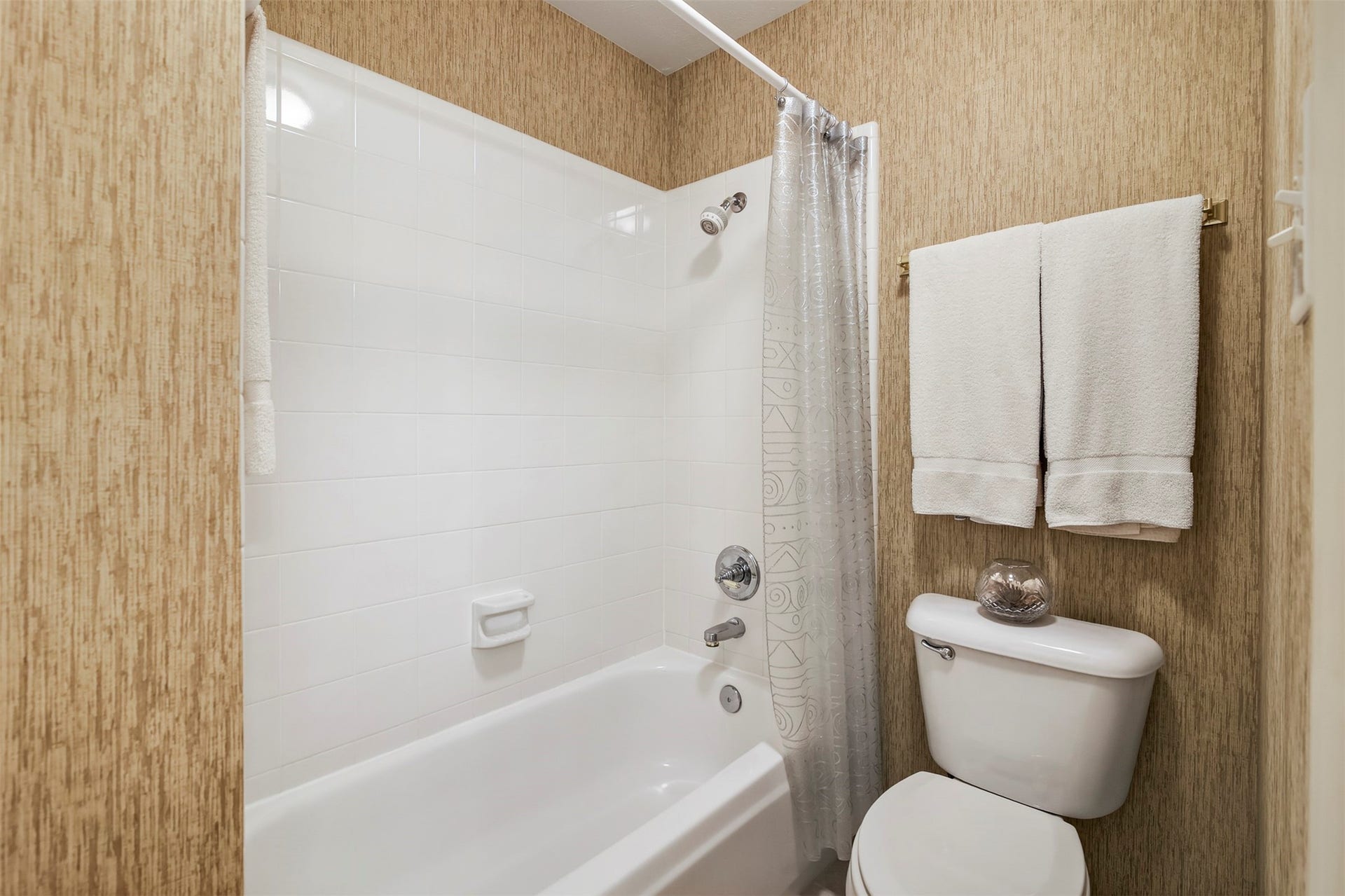 1414 Forest Bend, Sugar Land, TX 77479 Tub and shower combo located in the shared secondary full bathroom.