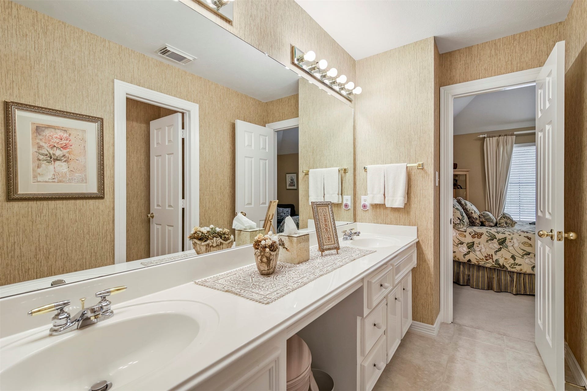 1414 Forest Bend, Sugar Land, TX 77479 View of the secondary full bathroom upstairs with double sinks and knee space vanity.