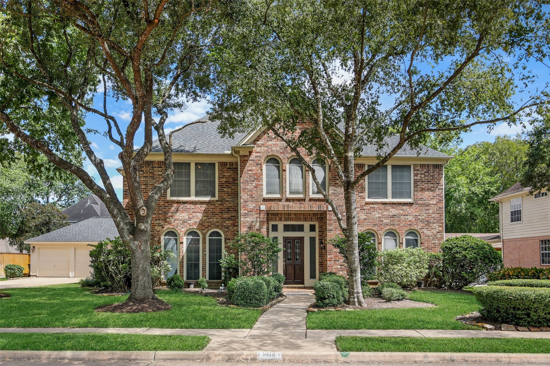 1414 Forest Bend, Sugar Land, TX 77479 Charming two-story home with lots of custom details in the master planned community of Greatwood. *Grass virtually enhanced*